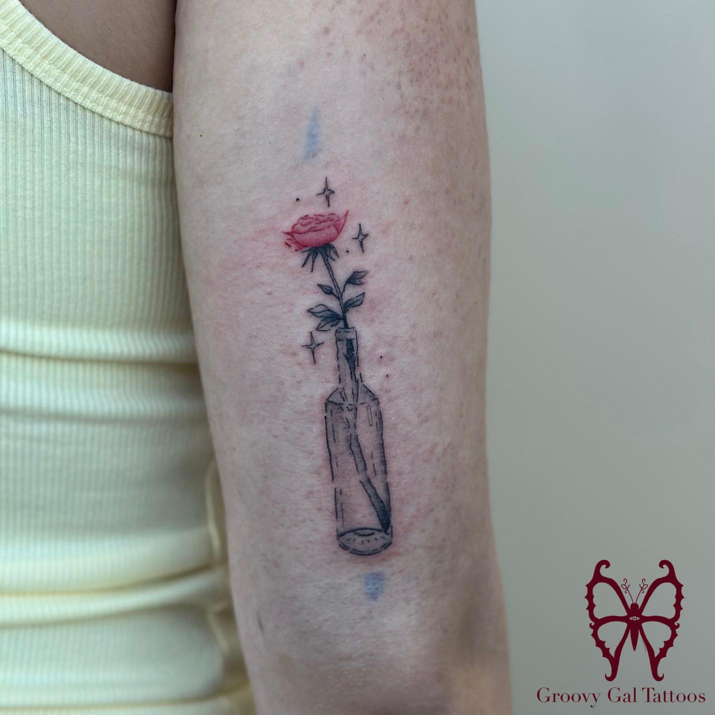 Rose in bottle dotwork tattoo on the forearm by Groovy P