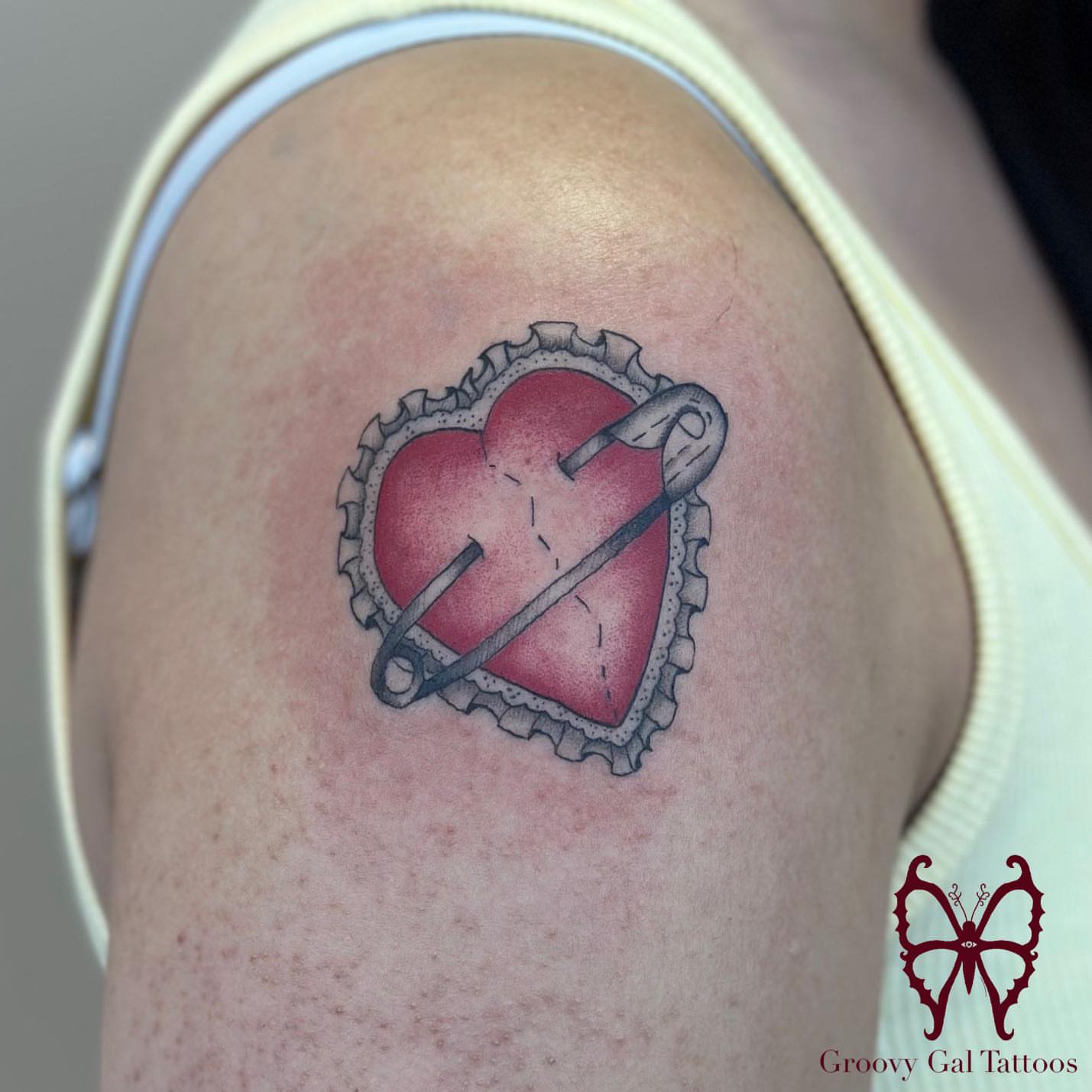 Heart with needle dotwork tattoo on the shoulder by Groovy P