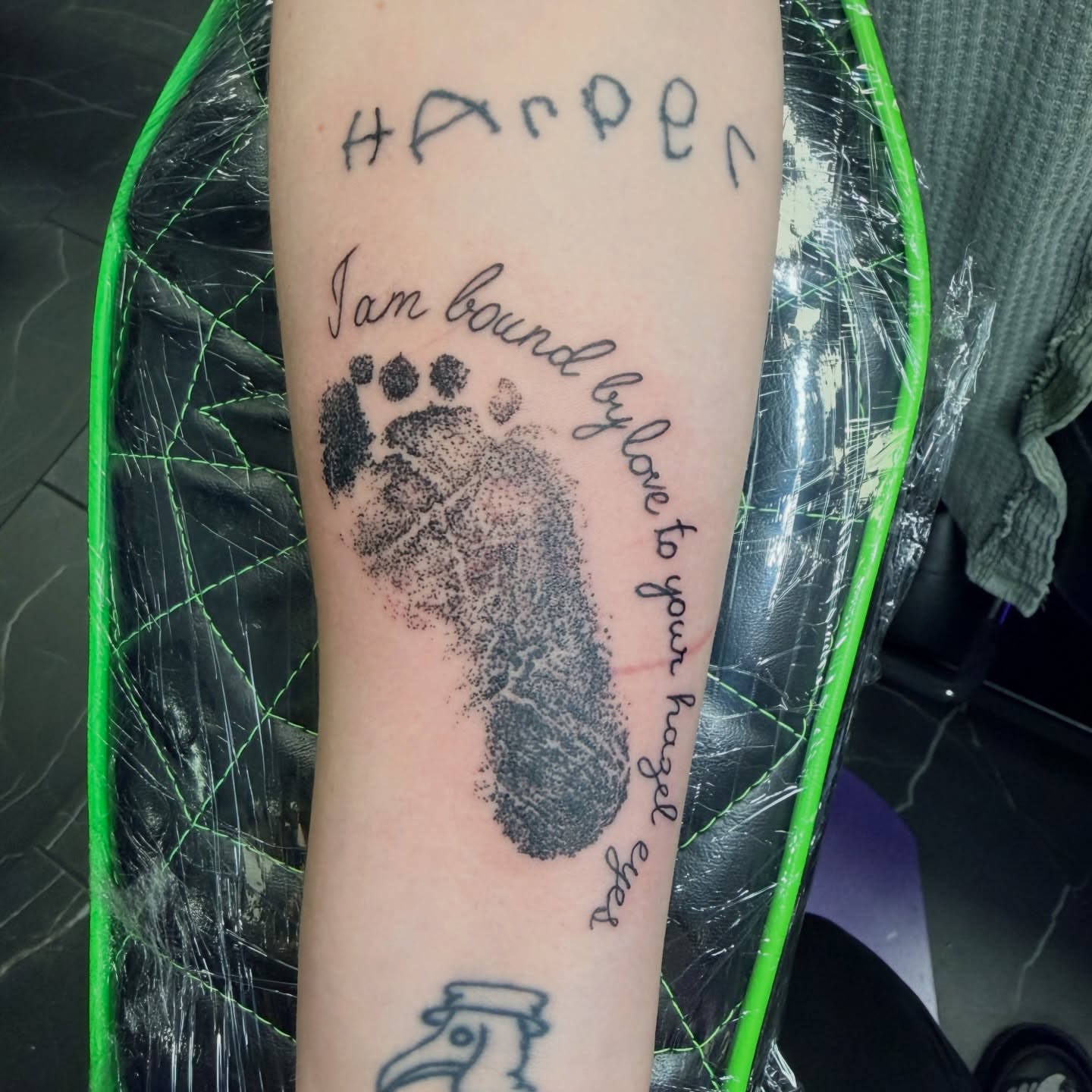 Footprint with text dotwork tattoo on the forearm by Stephanie Comito-Stephens