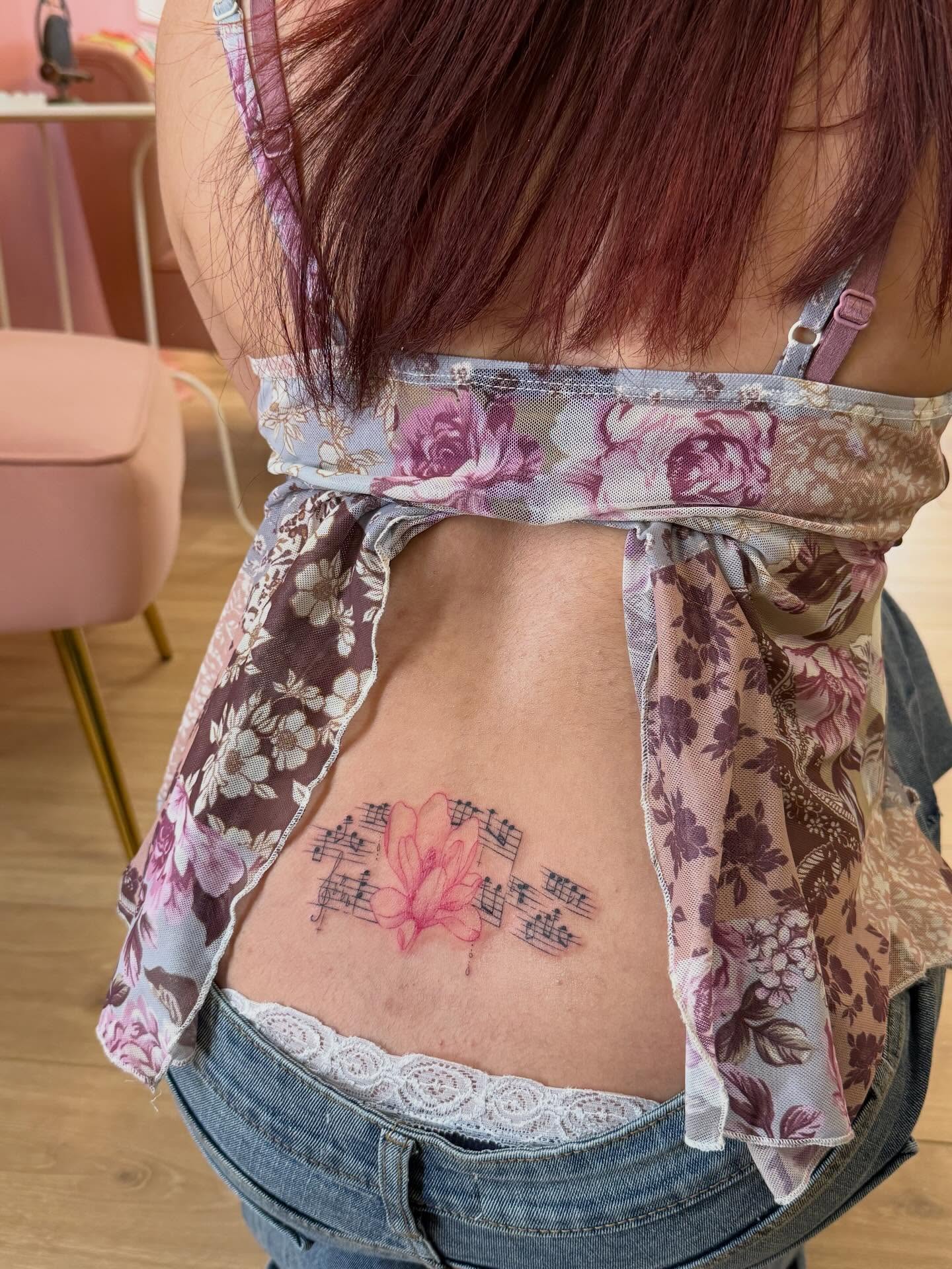 Flower and music notes dotwork tattoo on the back by Rachel ˚⊱🪷⊰˚ 芷若, Des Moines, Iowa