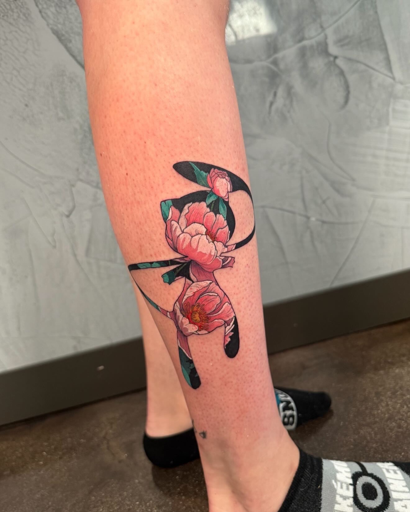 Peony flowers dotwork tattoo on the forearm by Ethan Lund
