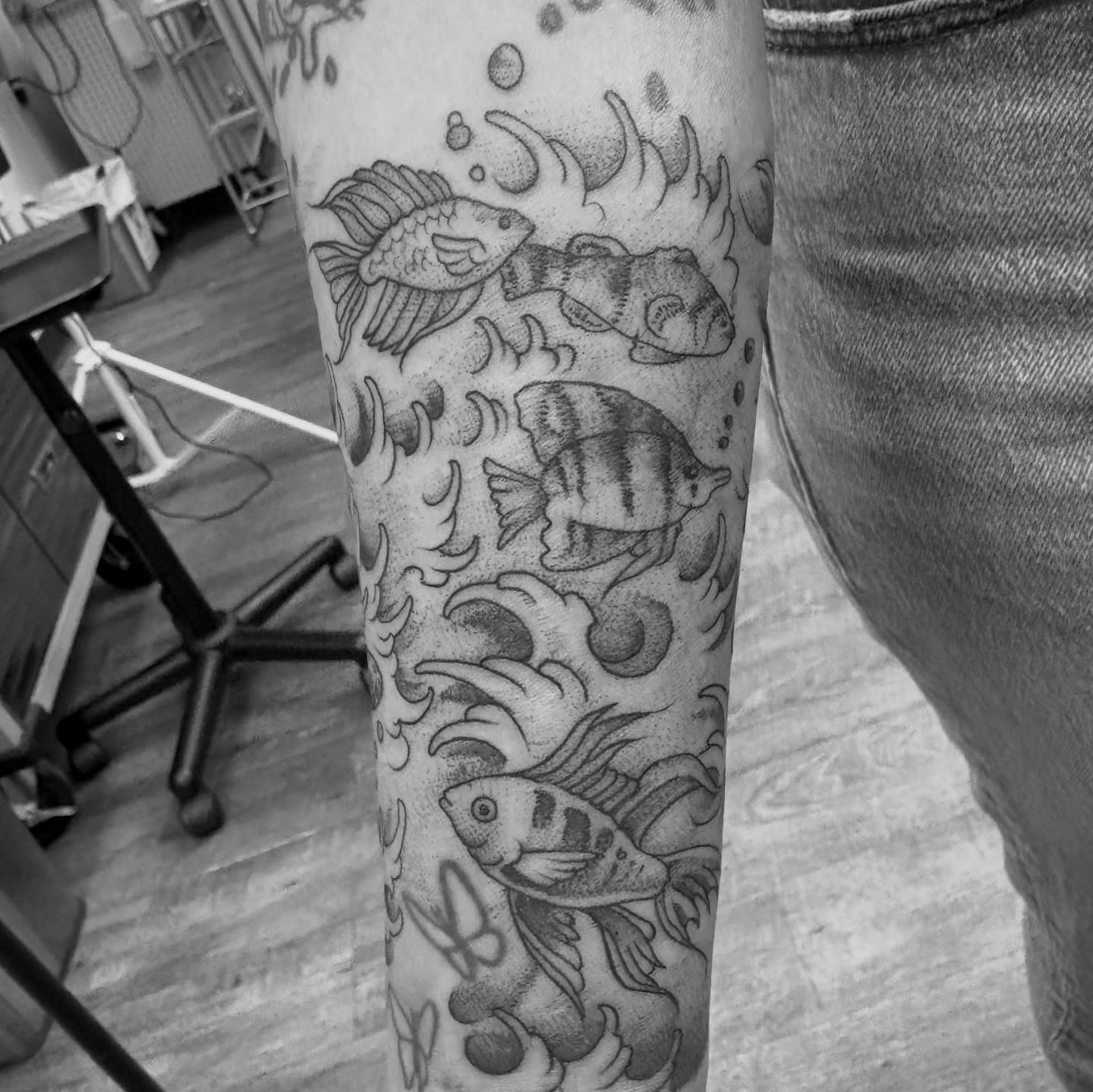 Fishes dotwork tattoo on the forearm by Jason Allen, Avondale, Arizona
