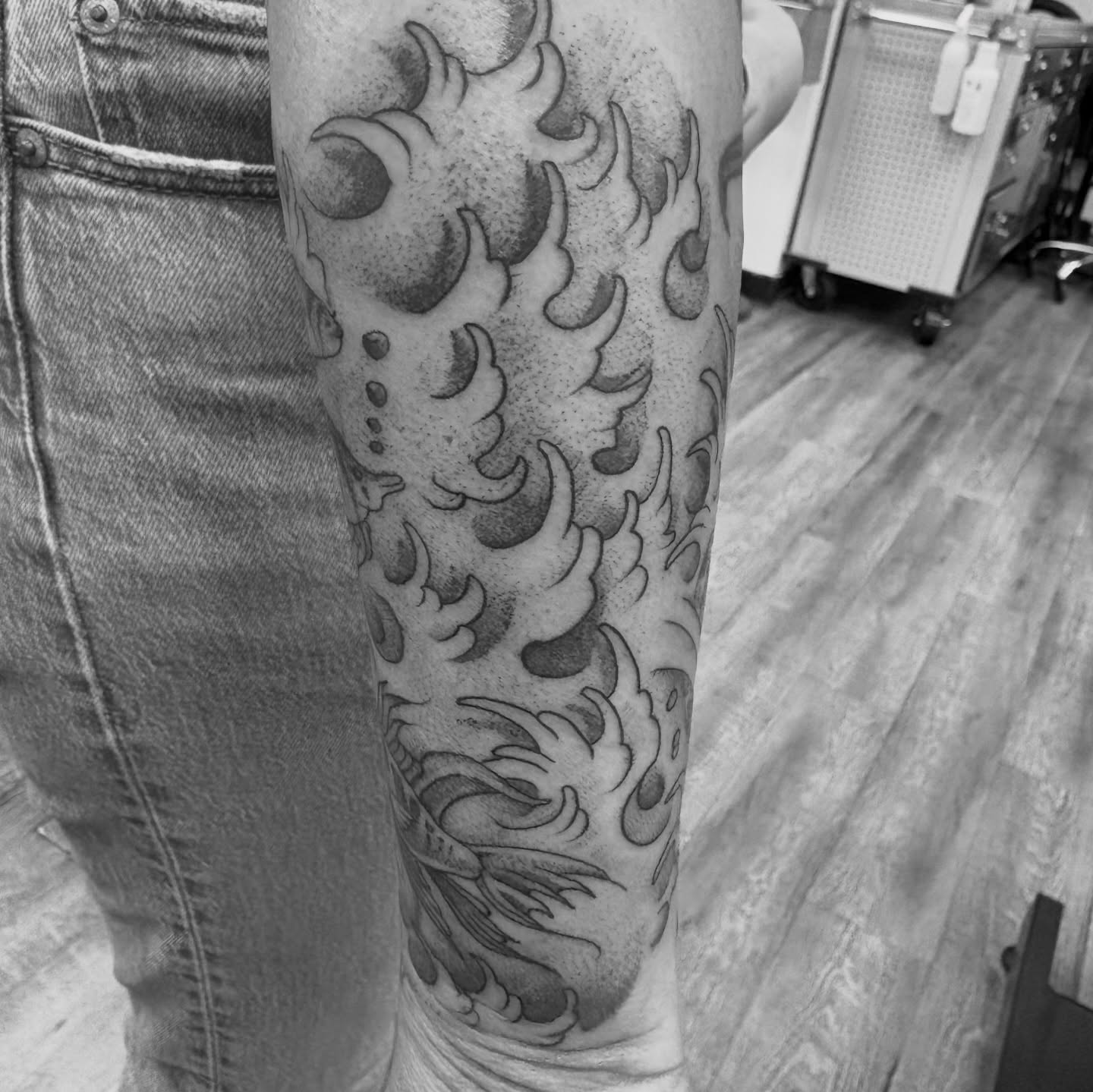 Flame and crescent moons dotwork tattoo on the forearm by Jason Allen, Avondale, Arizona
