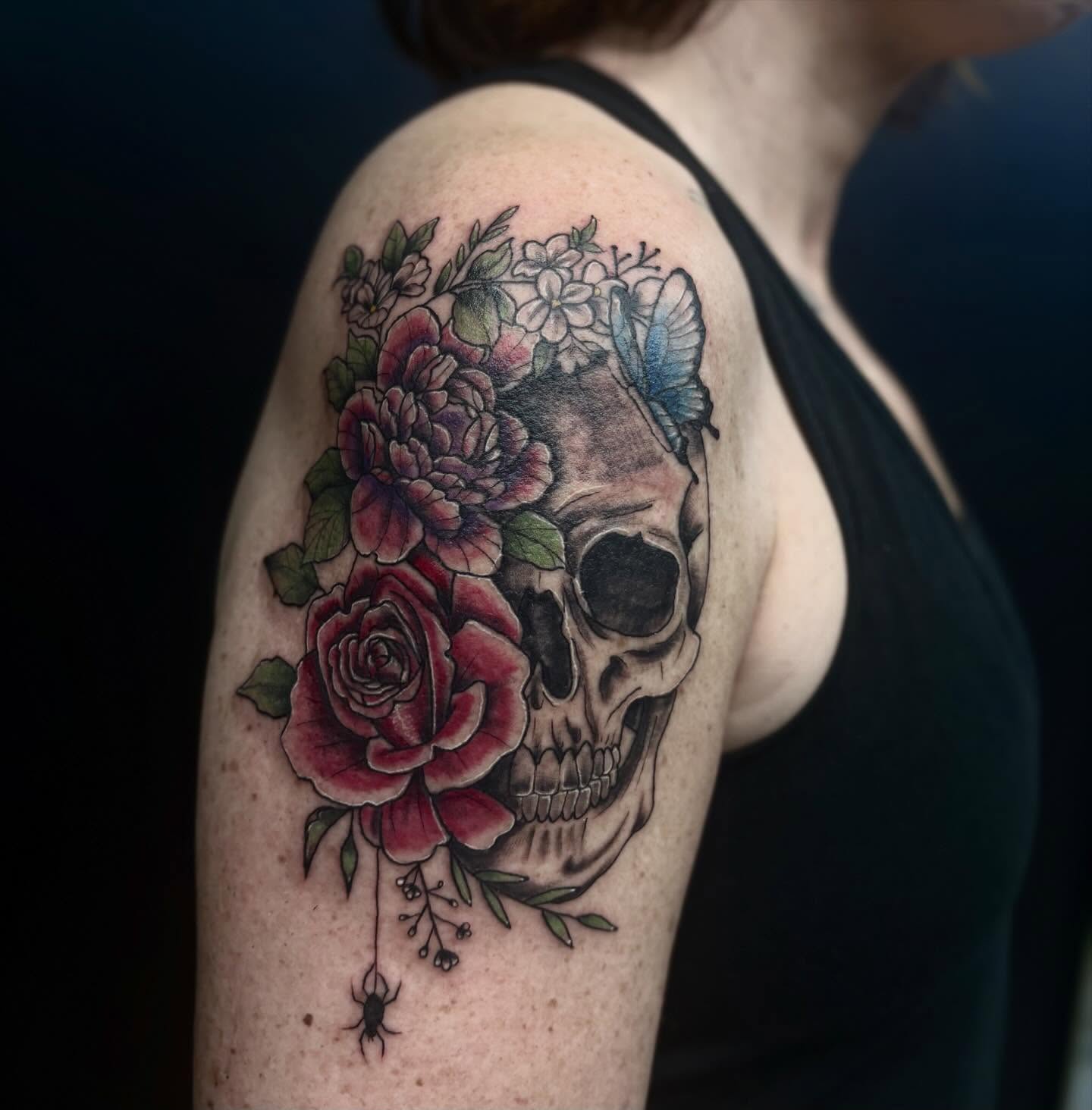 Skull with flowers realism tattoo on the shoulder by ππ©π’π΅ππ«π‘π―π ππ¬π«π’π°