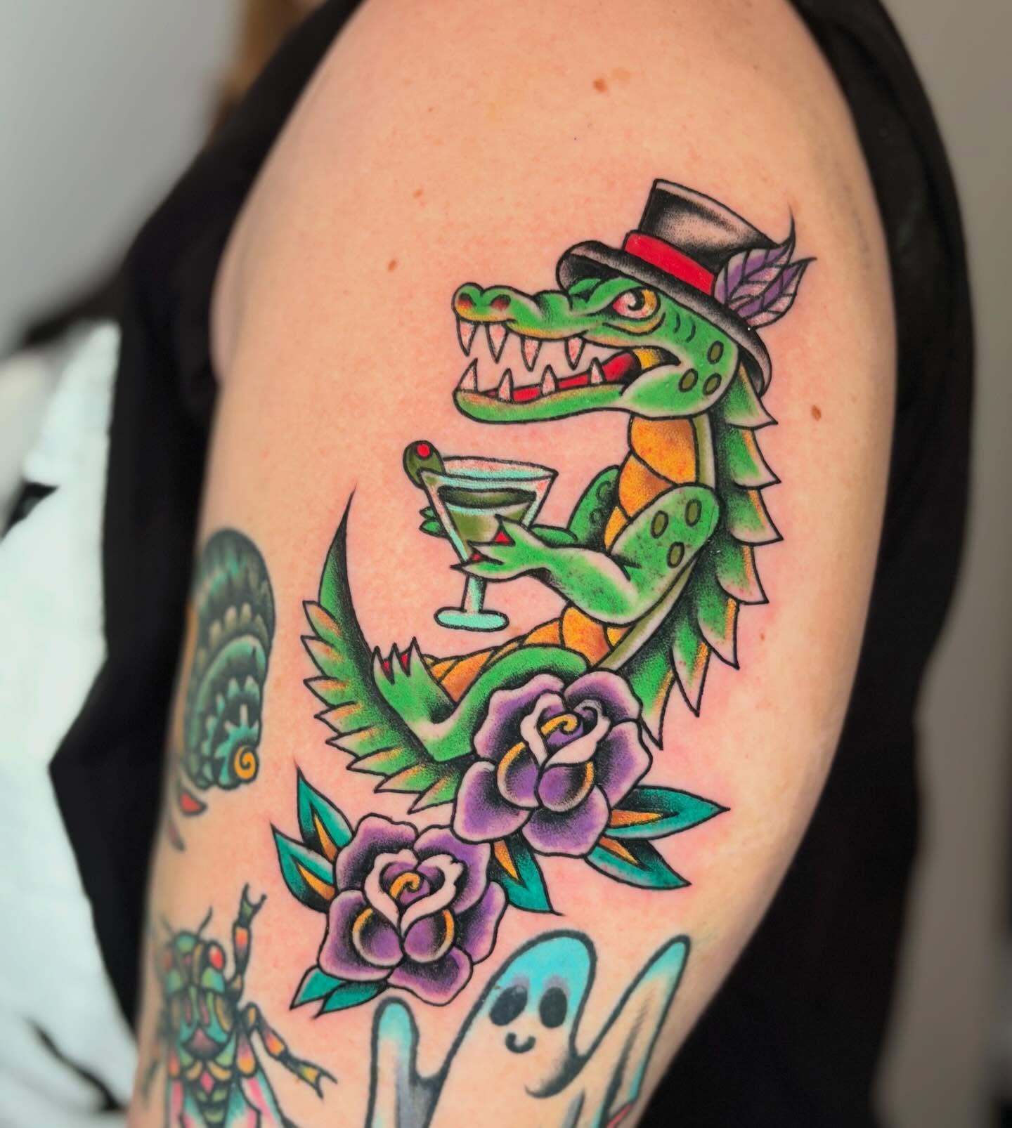 Alligator with cocktail American traditional tattoo on the shoulder by ๐ต๐๐๐๐ ๐ฎ๐๐๐๐๐๐, New Orleans, Louisiana
