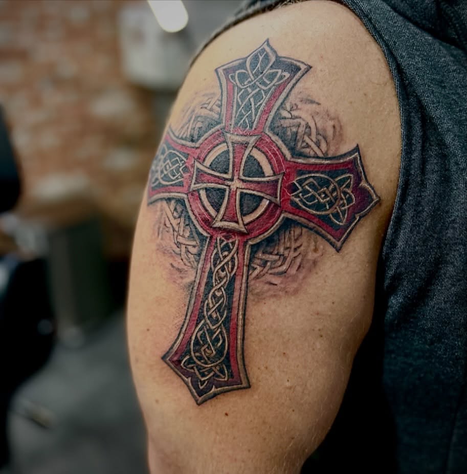 Celtic cross geometric tattoo on the shoulder by Matthew Clanin