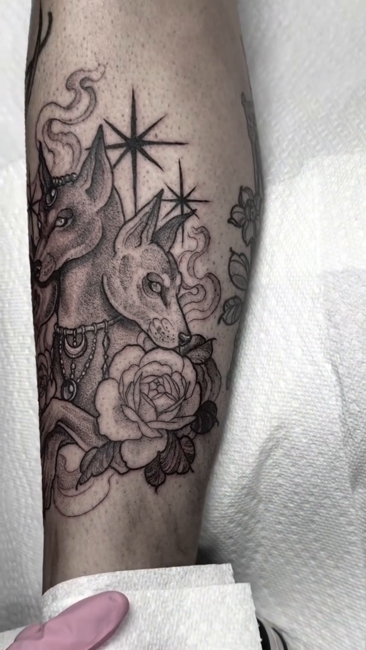 Three-headed dog with roses dark realism tattoo by Cincinnati