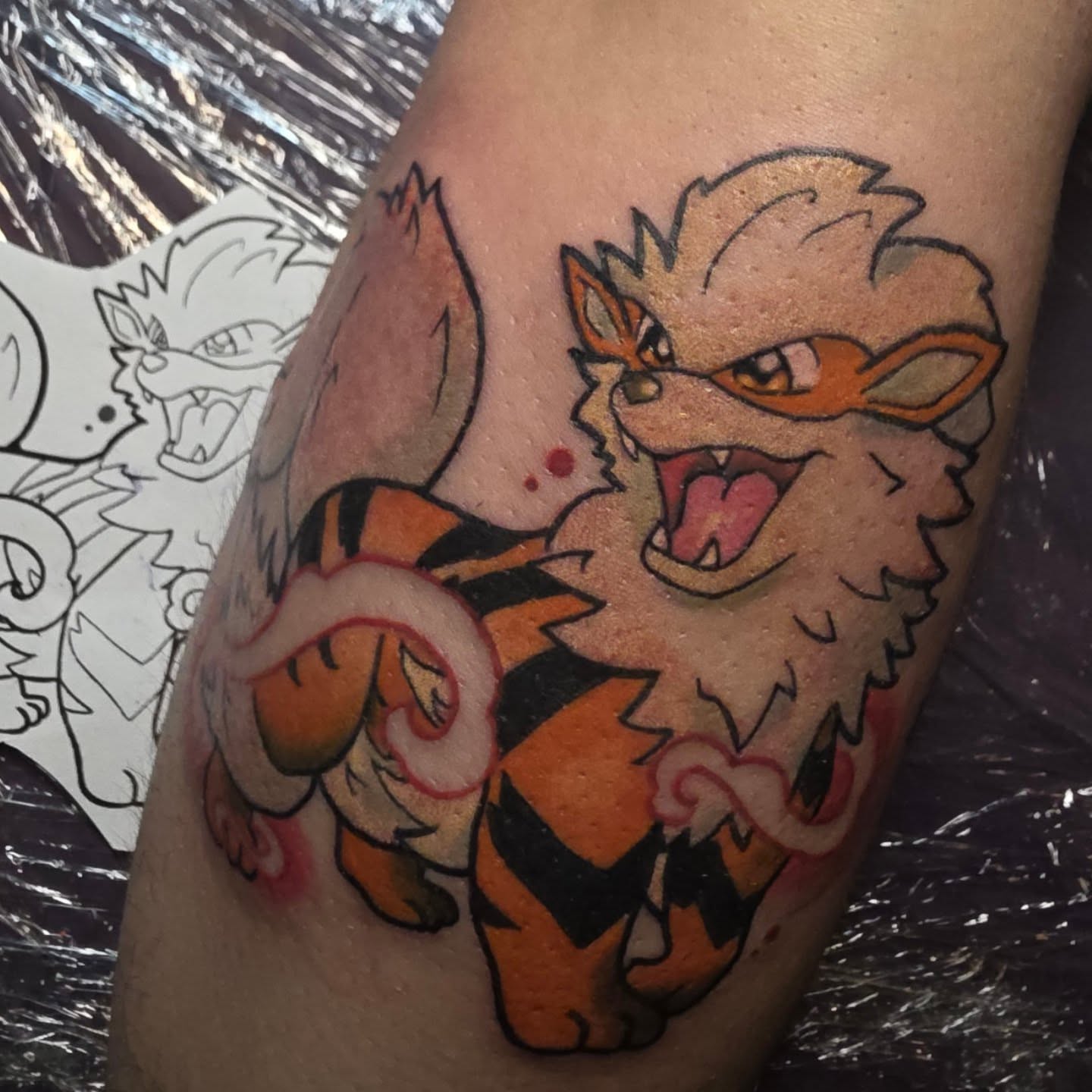 Growlithe American traditional tattoo on the forearm by Kayla Williams