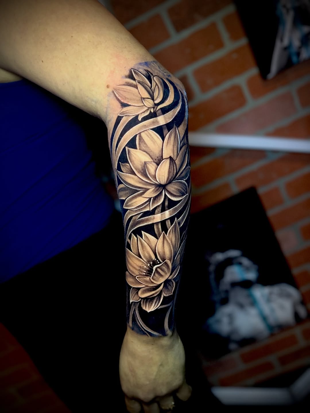 Lotus flowers geometric tattoo on the forearm by Andres Calvo🇺🇸🇨🇴