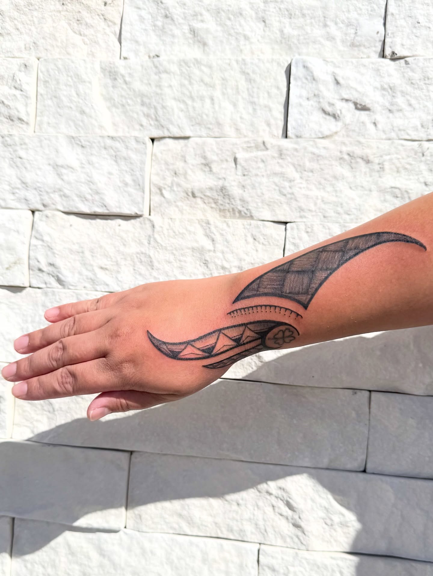 Dagger black and grey tattoo on the forearm by Healoha “Lindelle” Kamanu