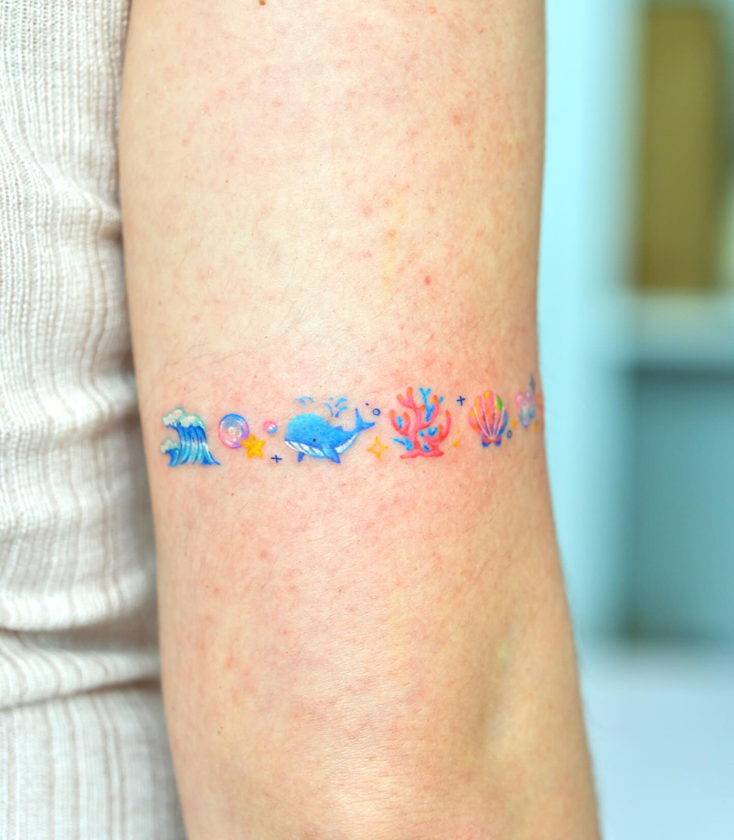 Underwater scene watercolor tattoo on the forearm by 타투 Seon 컬러타투