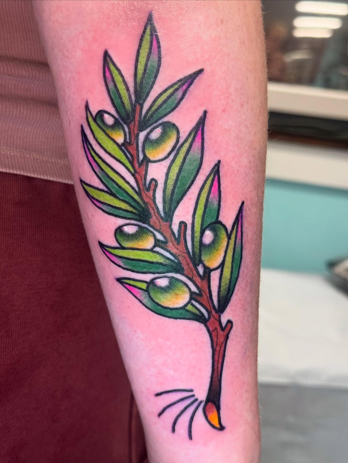Olive branch American traditional tattoo on the forearm by Kenneth Gibson