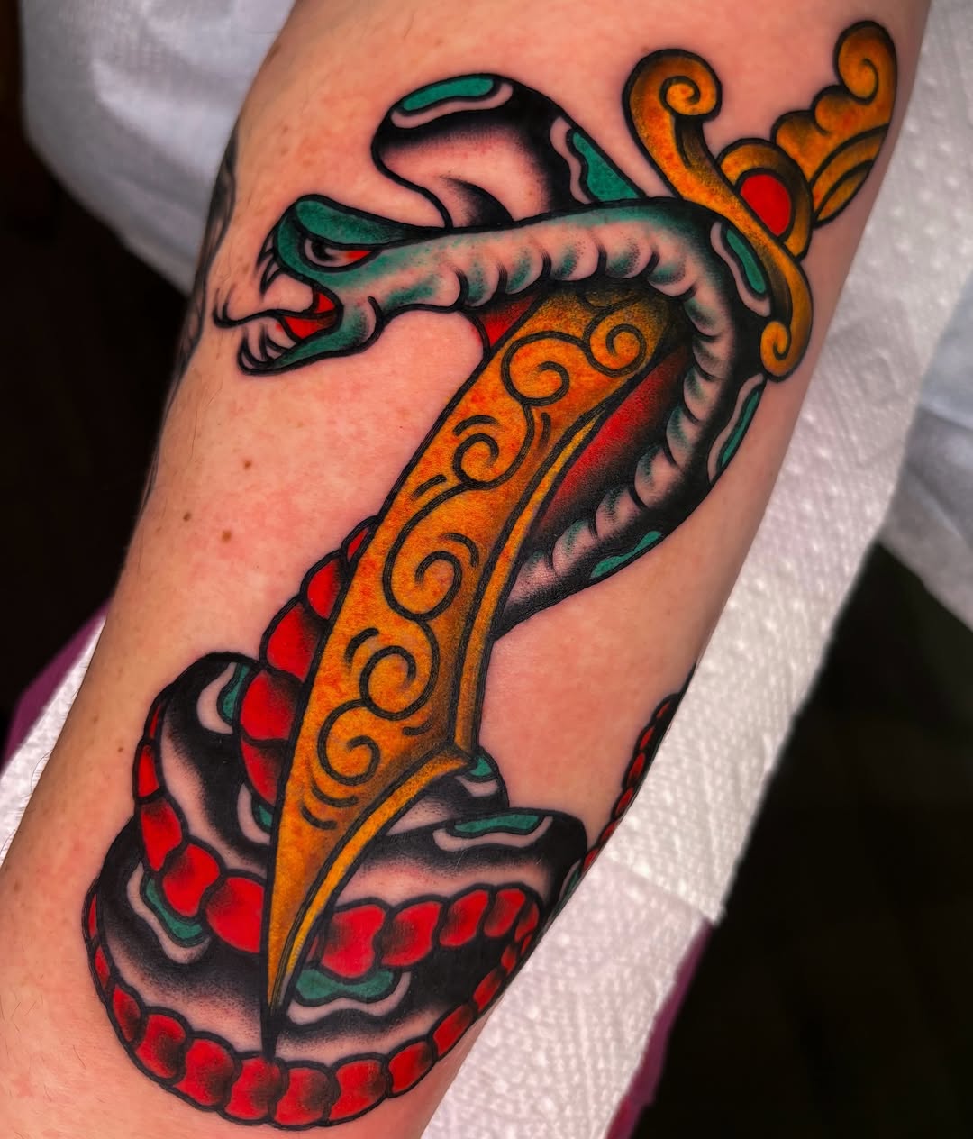 Snake and dagger American traditional tattoo on the forearm by ✨ Gabi ✨