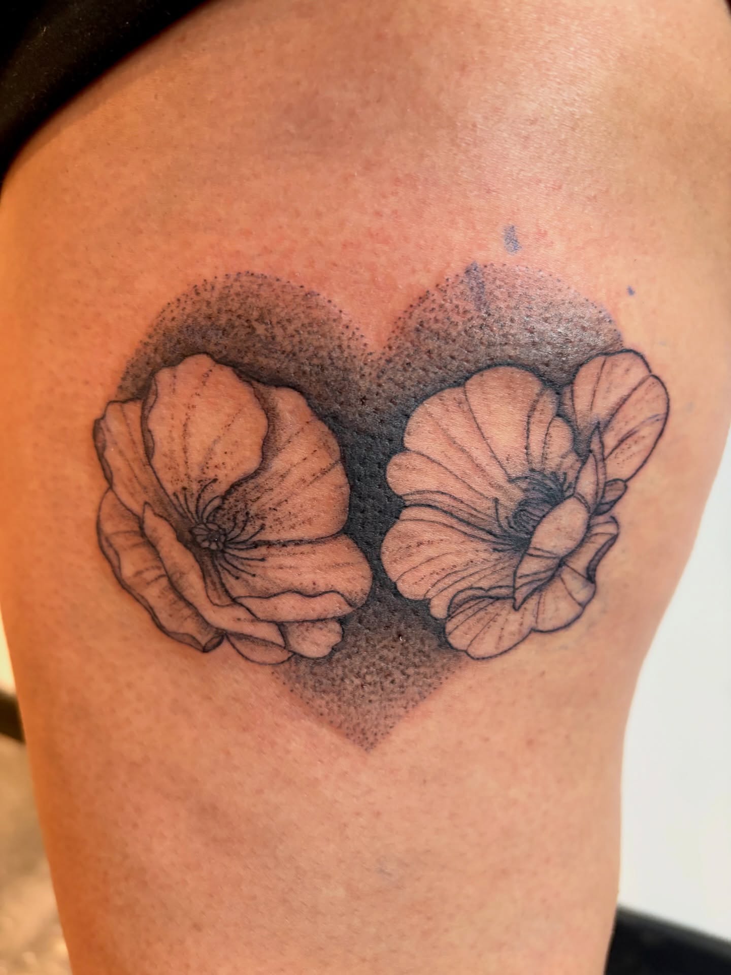 Flowers dotwork tattoo on the shoulder by Emily, Monticello, Iowa