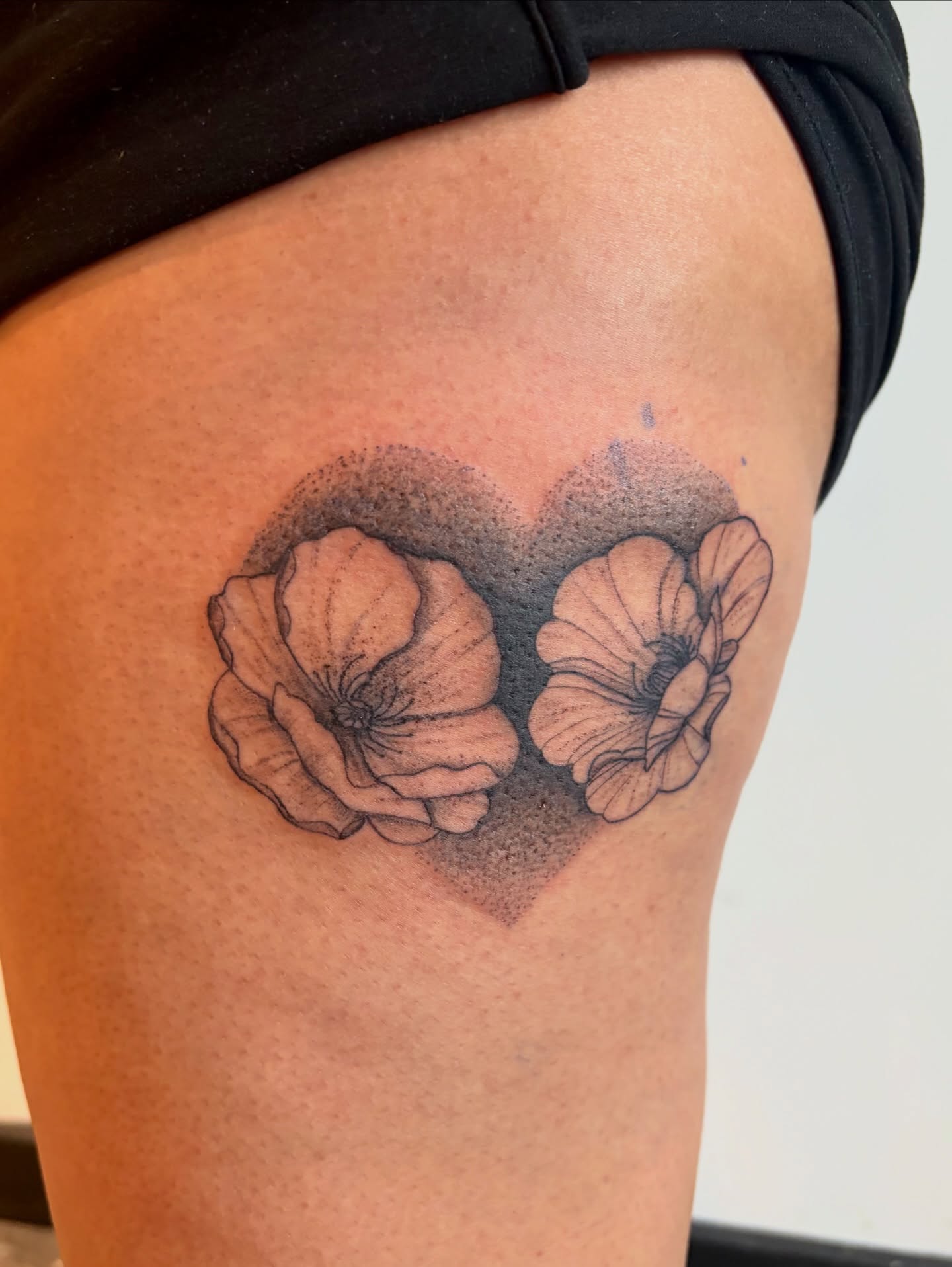 Poppy flowers dotwork tattoo on the thigh by Emily, Monticello, Iowa