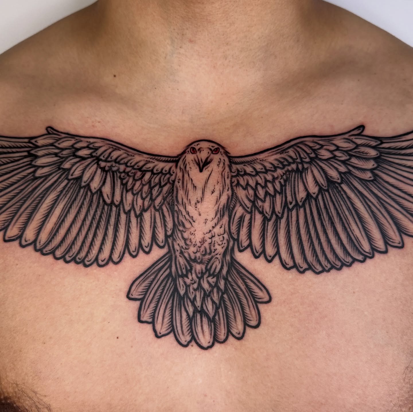 Eagle black and grey tattoo on the chest by rosalie