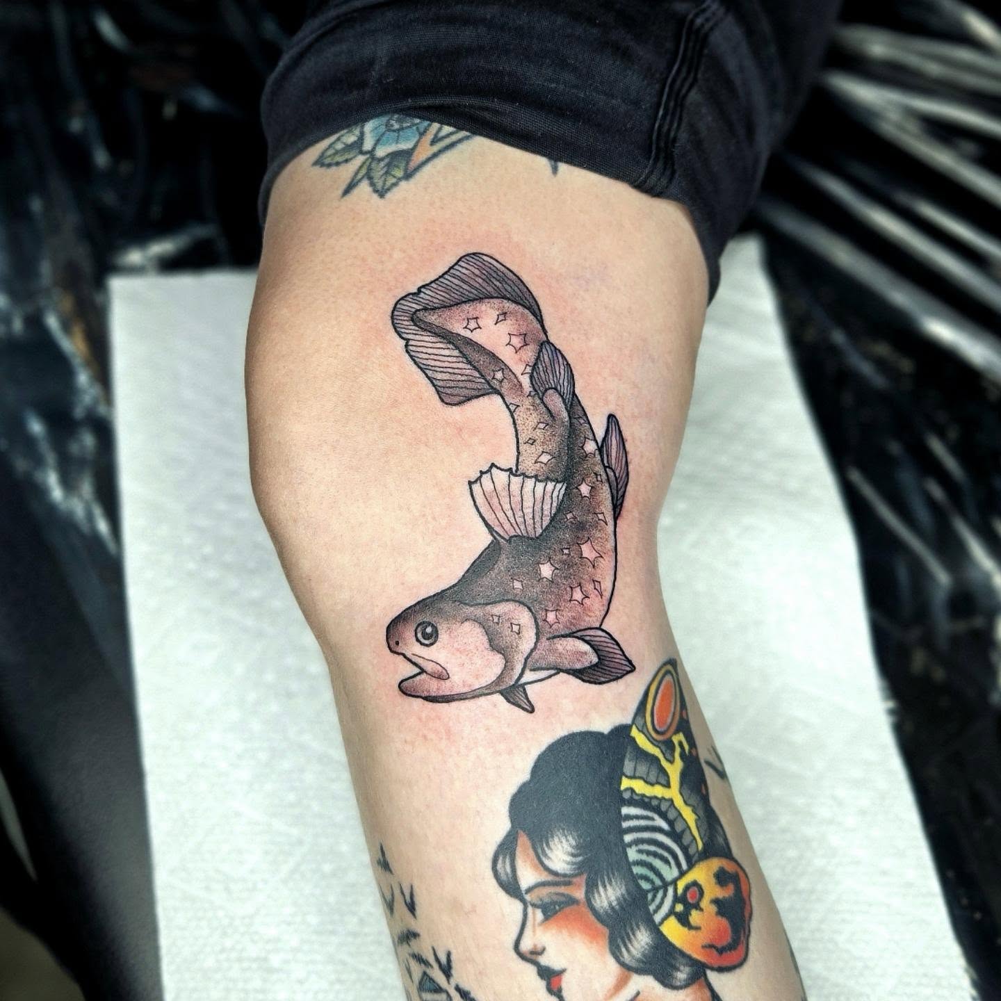 Fish American traditional tattoo on the thigh by Amanda Hinrichs