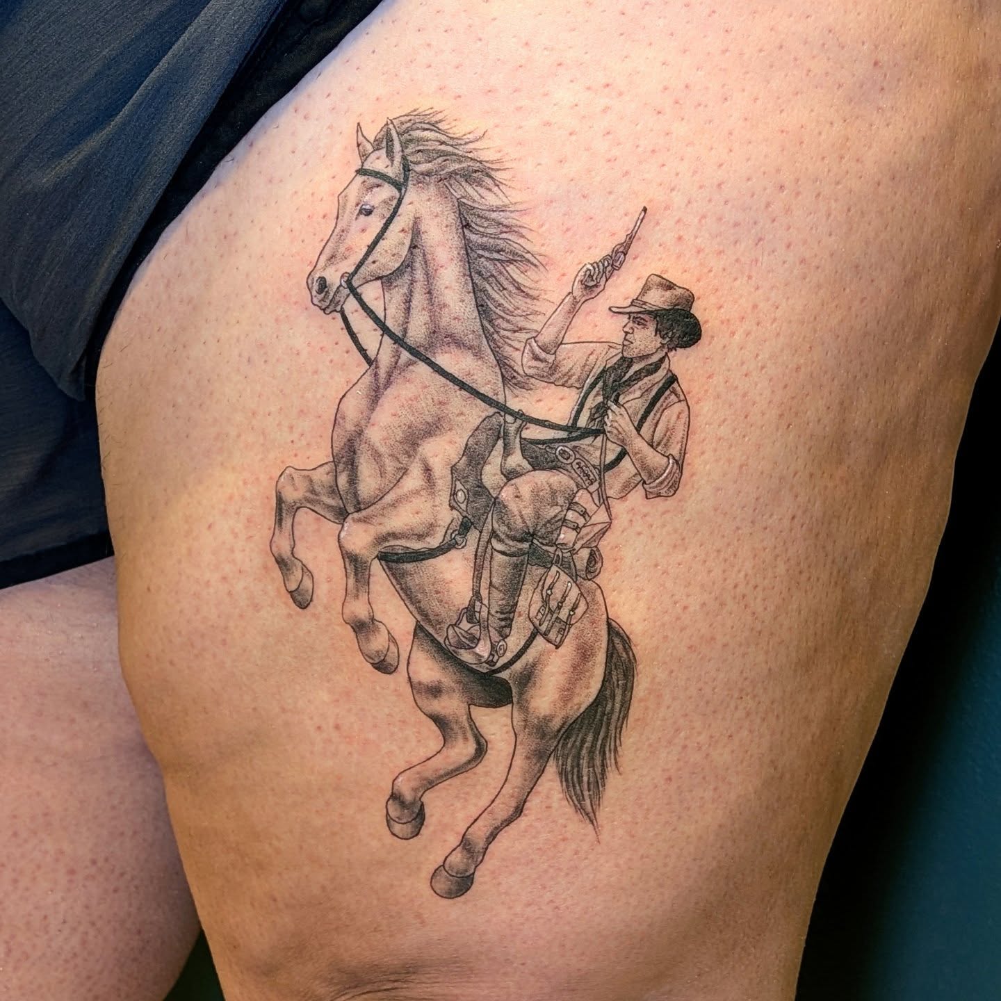 Cowboy on horseback realism tattoo on the thigh by L U C y, Knoxville, Tennessee