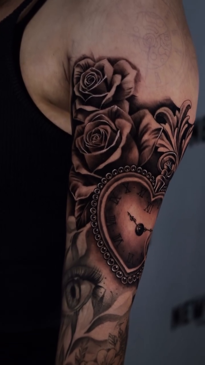 Heart-shaped pocket watch with roses realism tattoo by Anthony Maya
