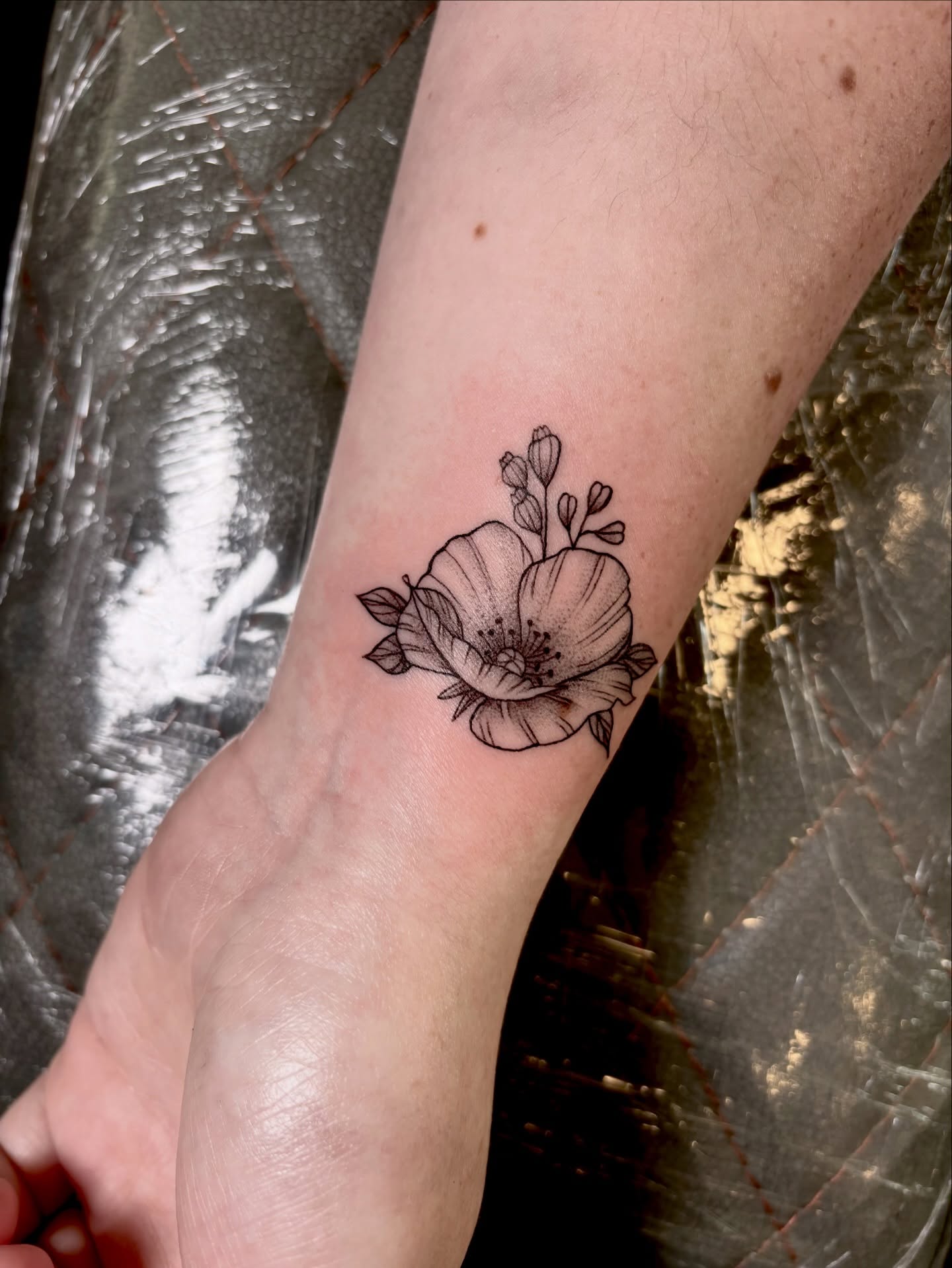 Flower black and grey tattoo on the forearm by Barbara Gonzalez