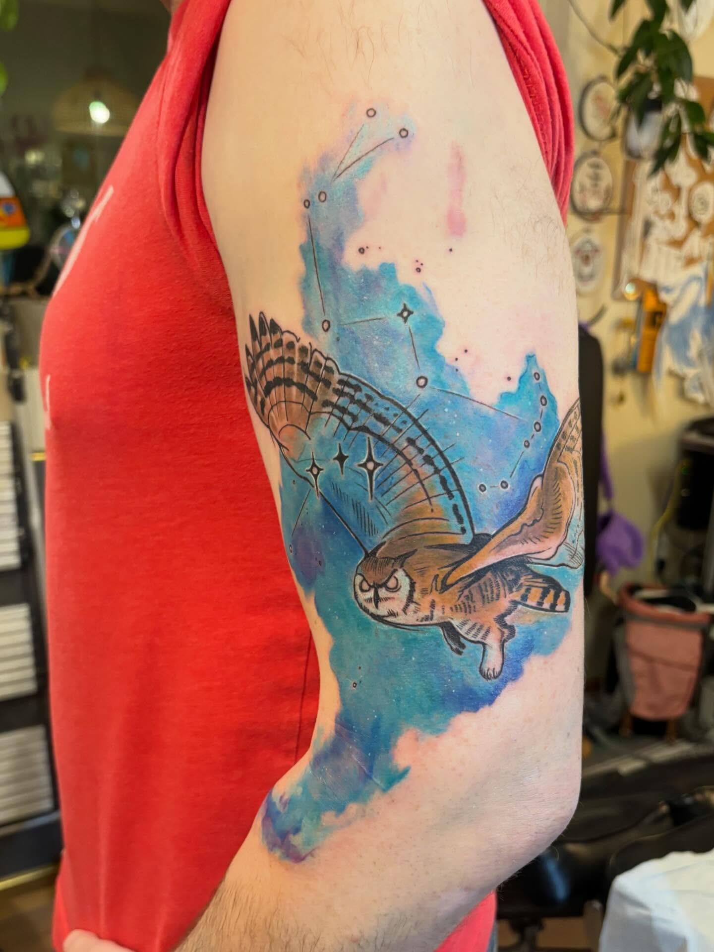 Owl watercolor tattoo on the forearm by Zoe Brookes