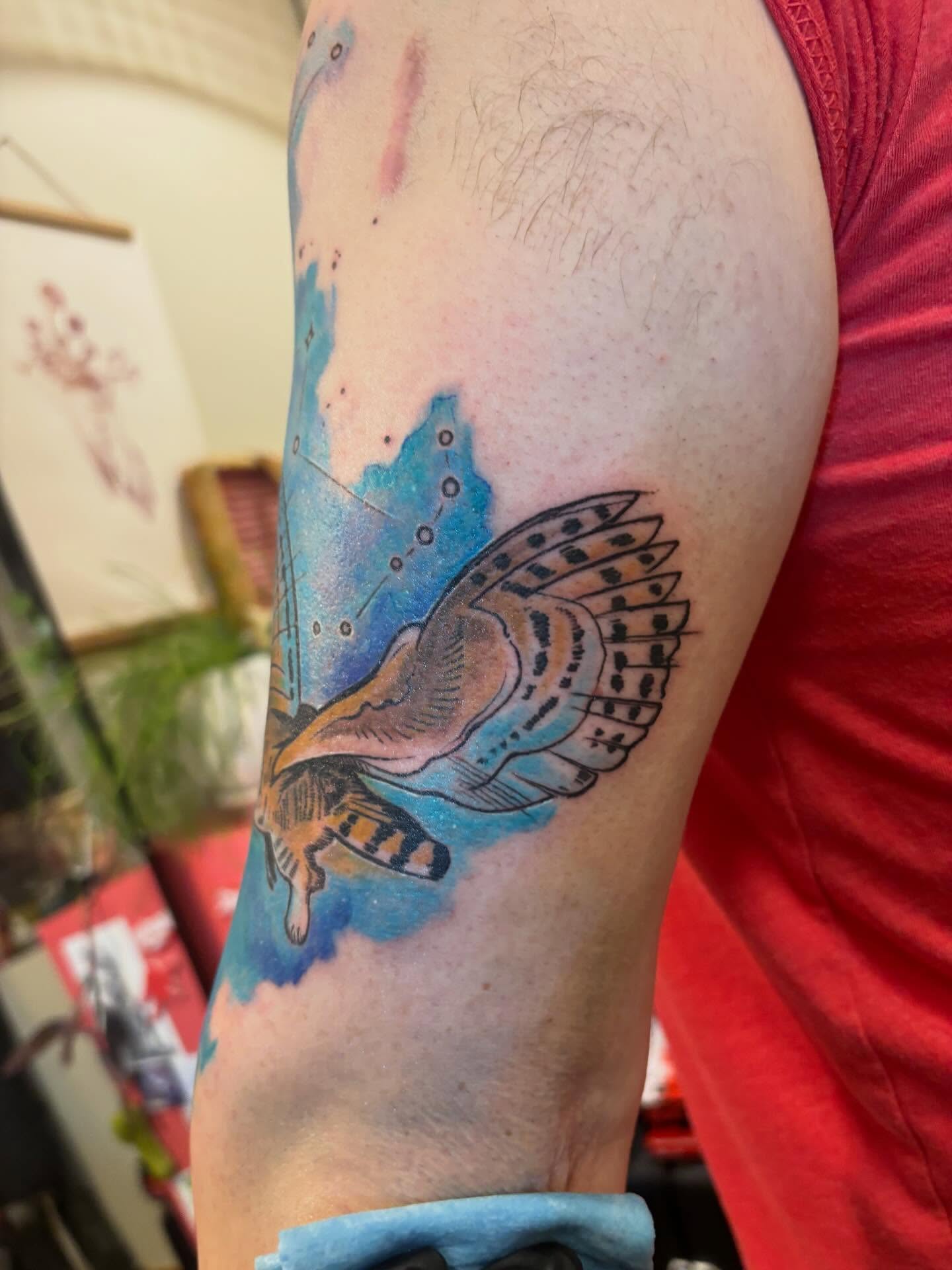 Butterfly watercolor tattoo on the forearm by Zoe Brookes