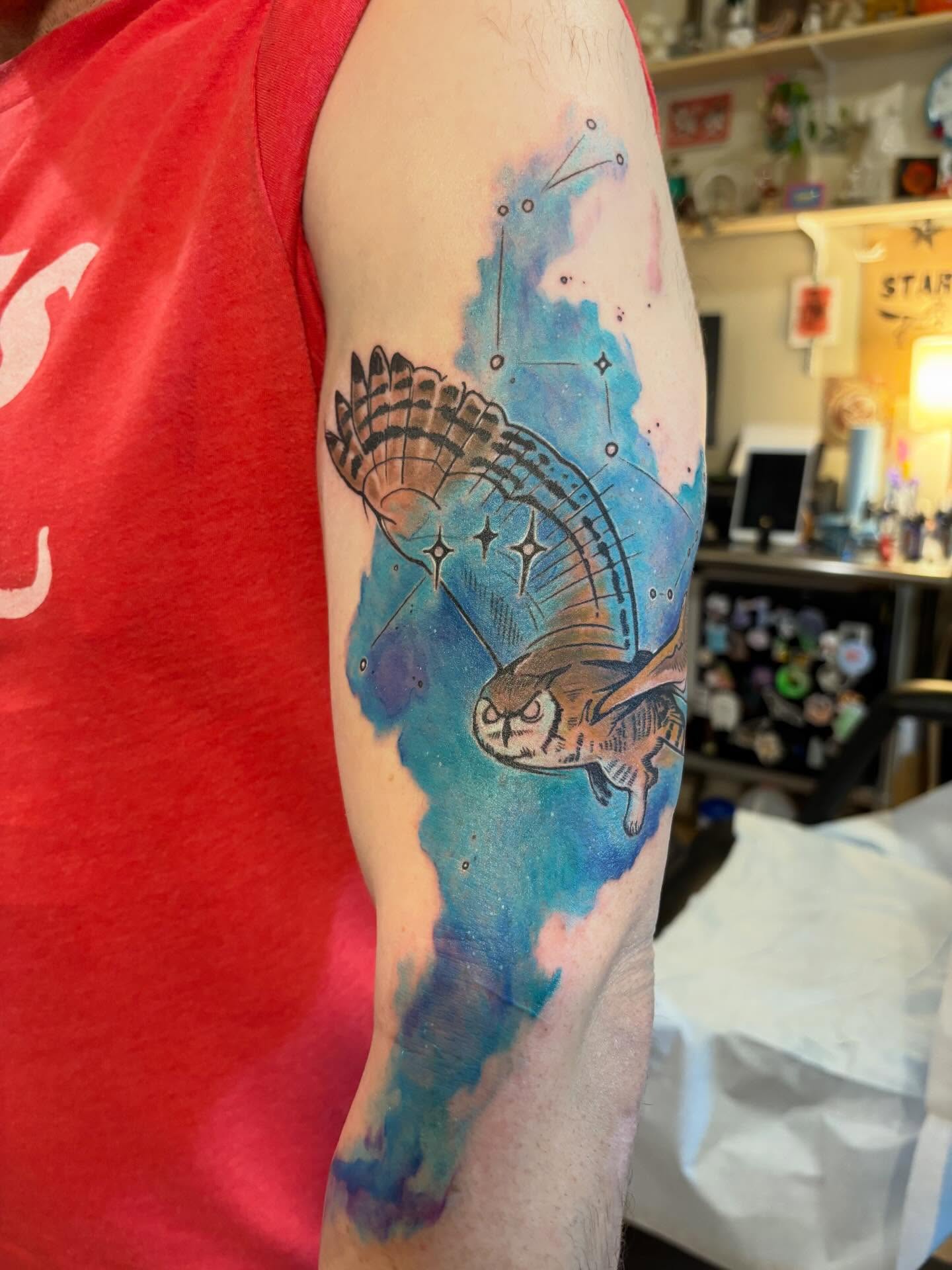 Owl watercolor tattoo on the forearm by Zoe Brookes