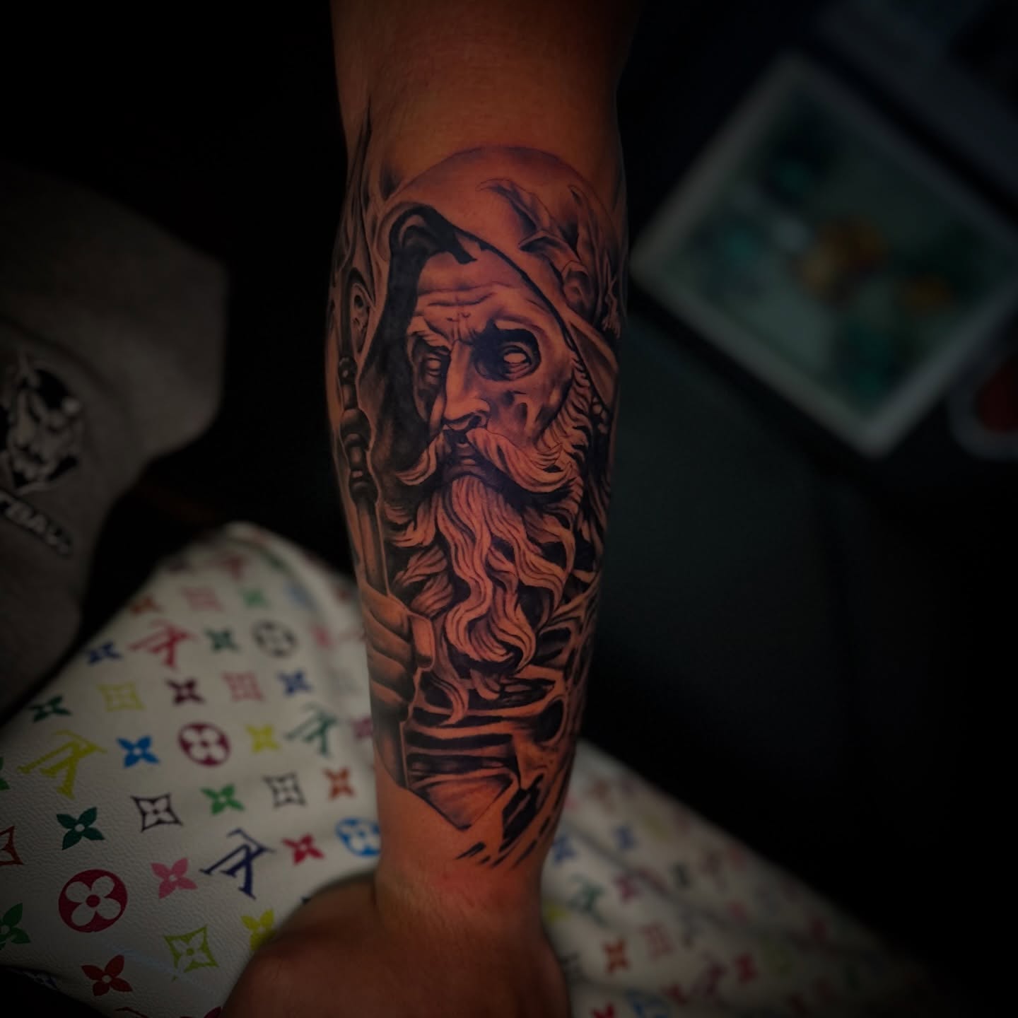 Ancient sage realism tattoo on the forearm by Robert Douglas