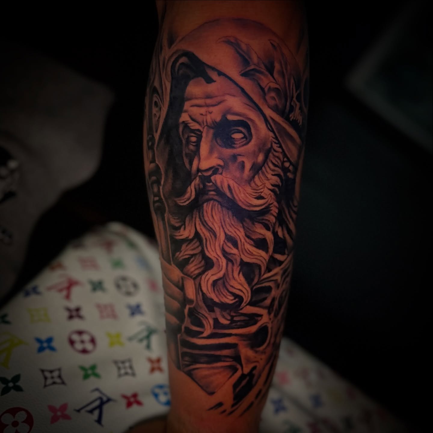 Bearded man realism tattoo on the forearm by Robert Douglas