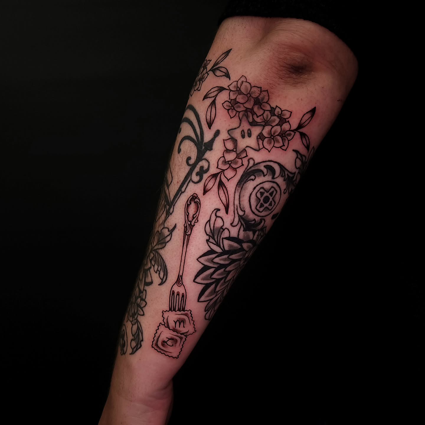 Floral arrangement black and grey tattoo on the forearm by Sheena Yu-Hsin Wood