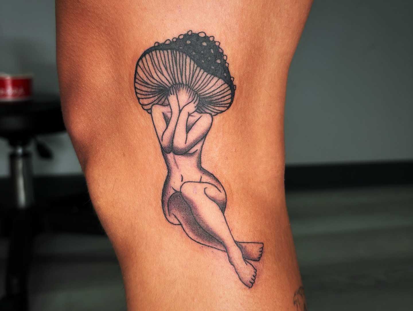 Mushroom woman black and grey tattoo on the thigh by Alexandria Gudiel
