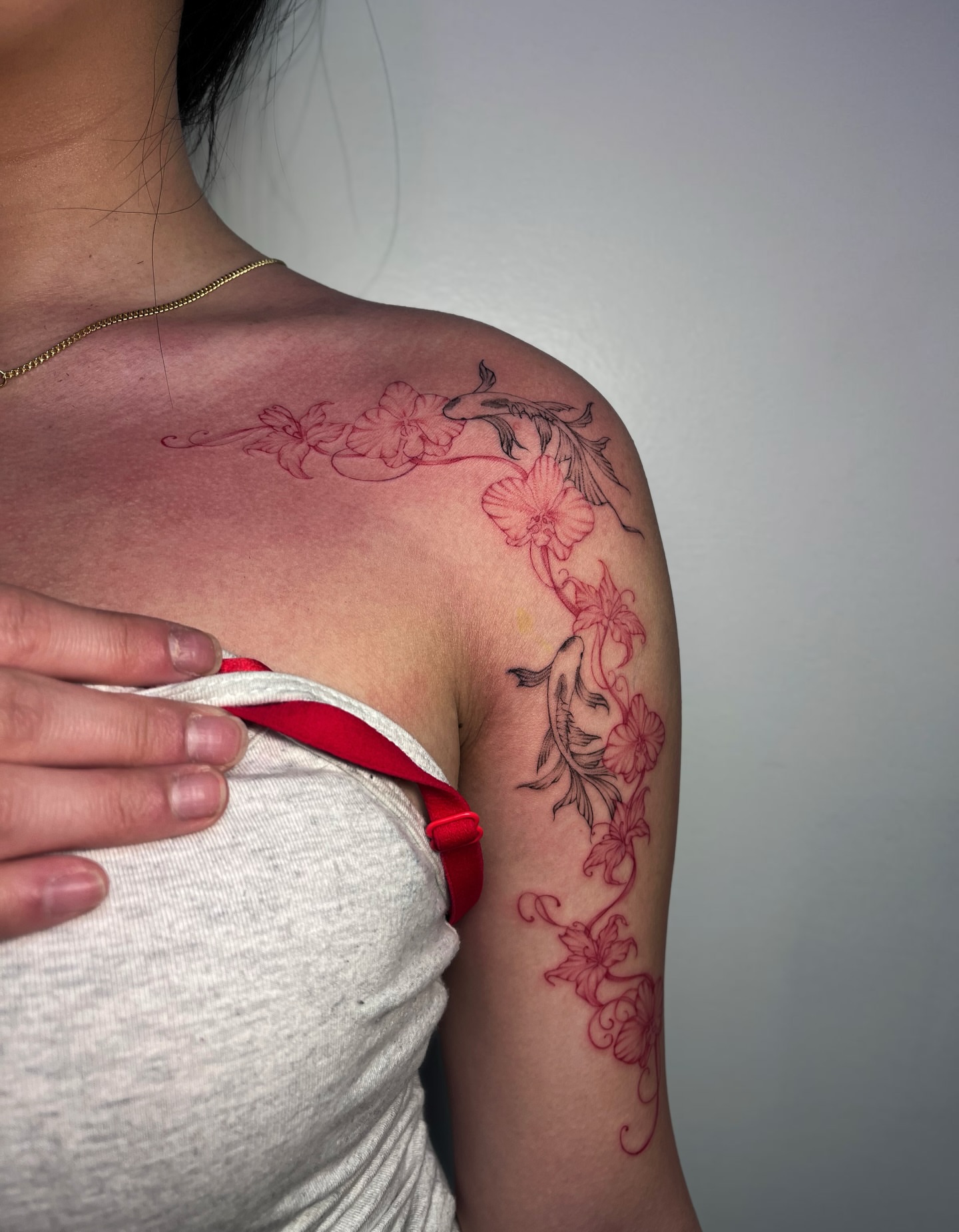 Cherry blossoms and fish dotwork tattoo on the shoulder by MK