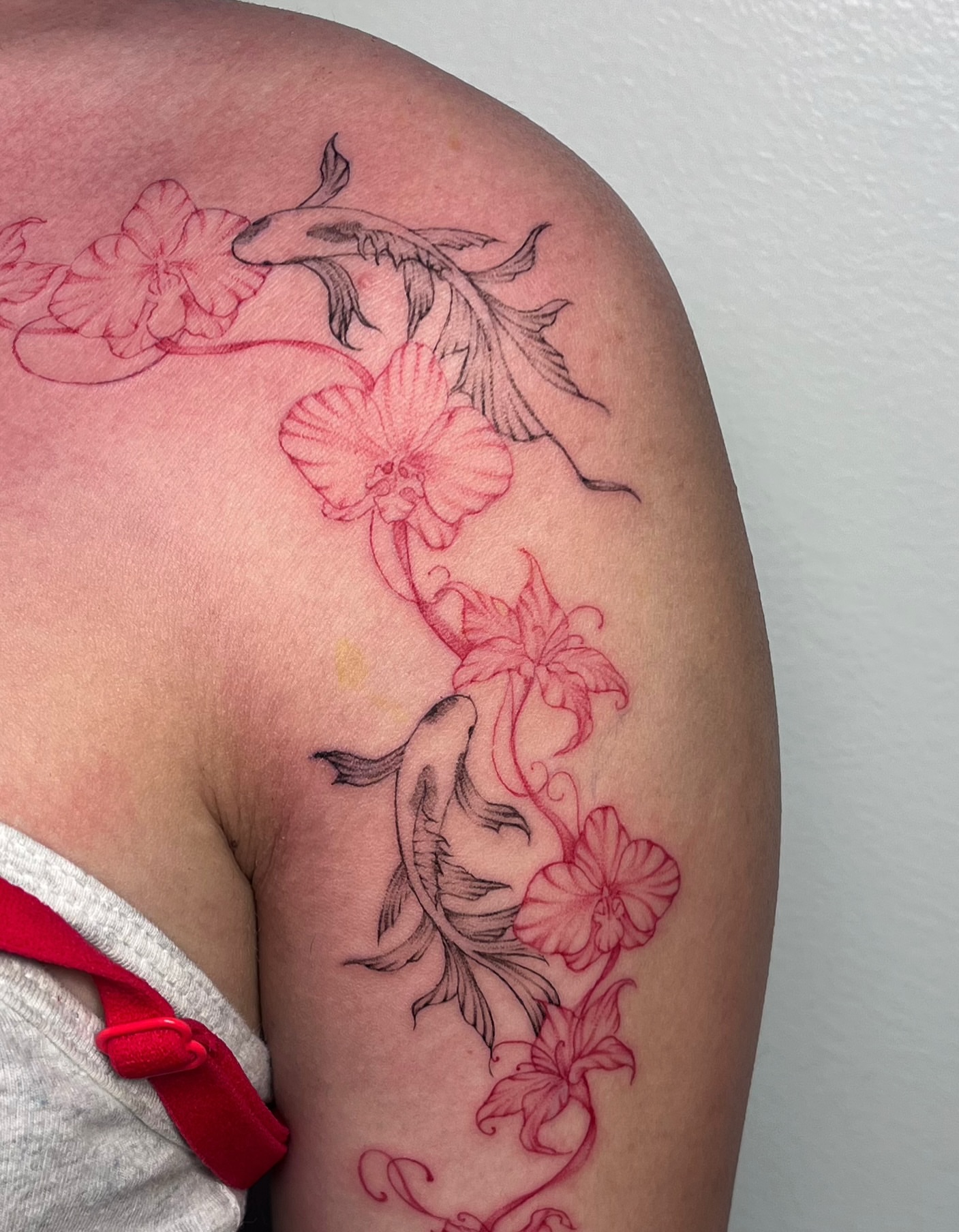 Koi fish and flowers new school tattoo on the shoulder by MK