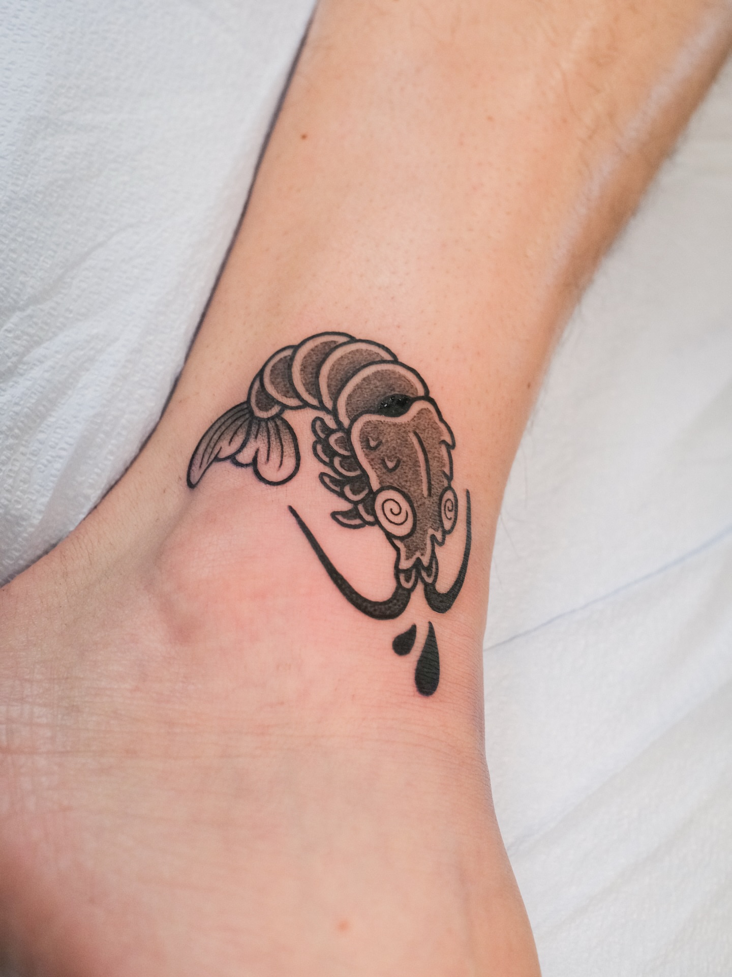 Koi fish black and grey tattoo on the foot by seattle tattoo artist