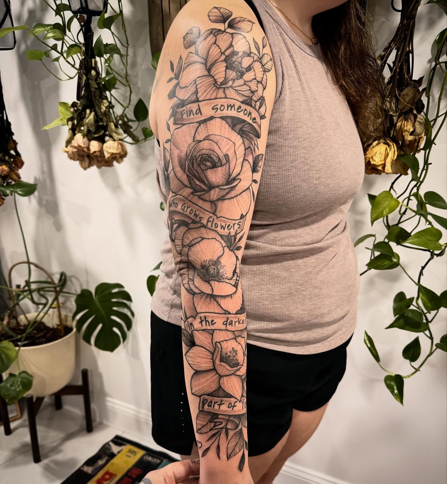 Flowers and roses black and grey tattoo on the upper arm by Shannon Misitano