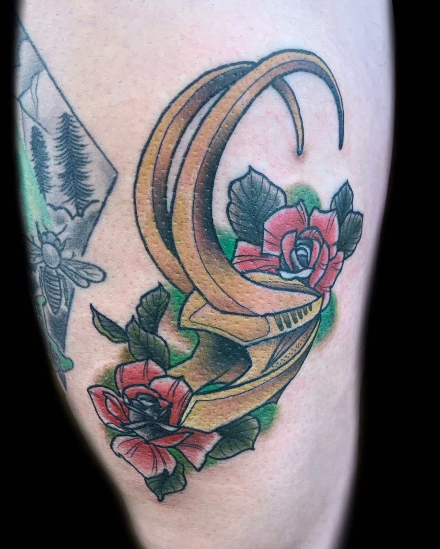 Snake and roses American traditional tattoo on the thigh by Nick Bones, Las Vegas, Nevada