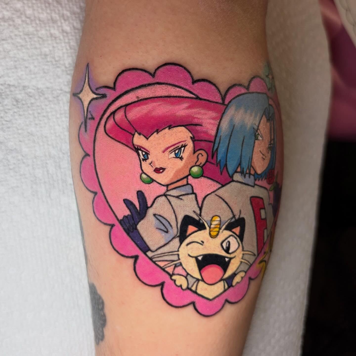 Anime characters anime tattoo on the forearm by Juliet Miller