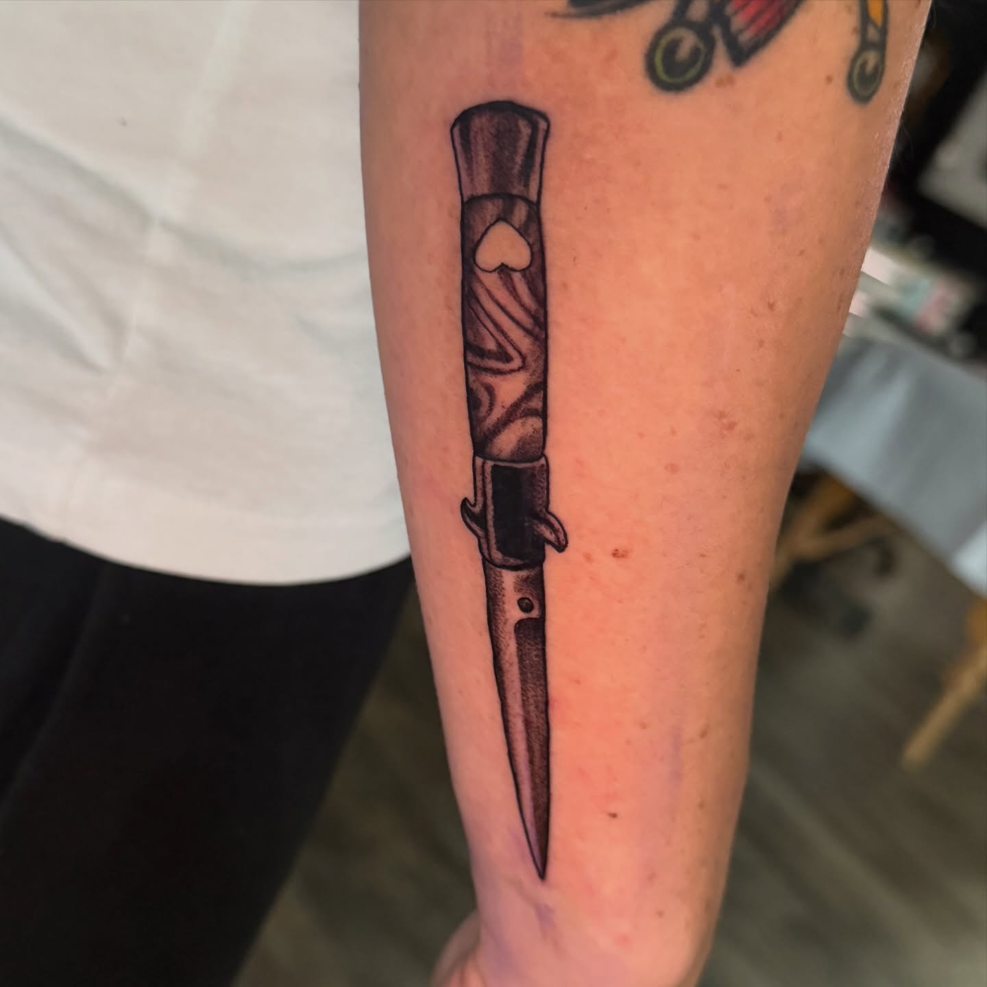 Knife black and grey tattoo on the forearm by hallow ☣︎ tattoo artist, Philadelphia, Pennsylvania