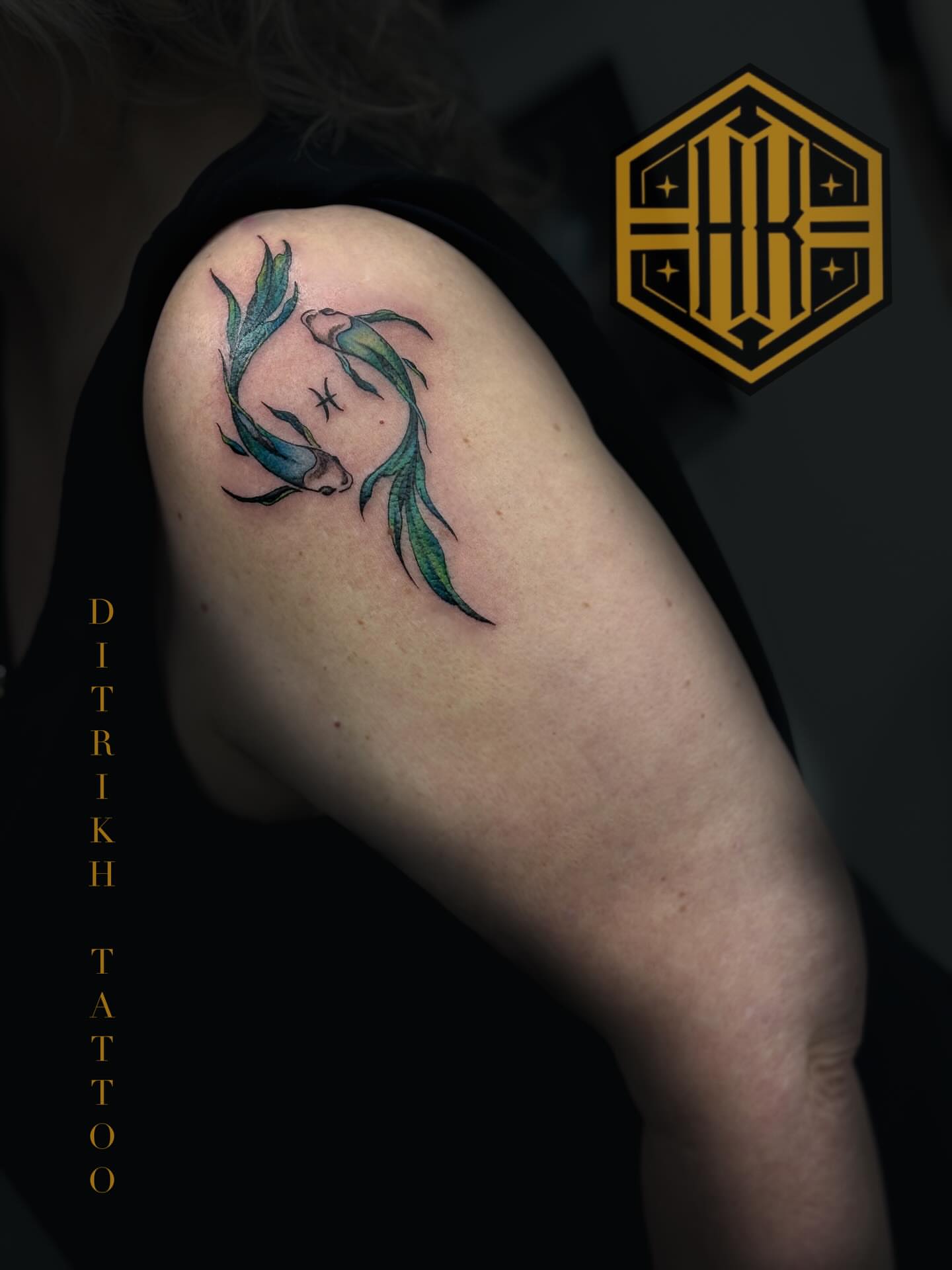 Two fish realism tattoo on the shoulder by KET, Calgary, Alberta