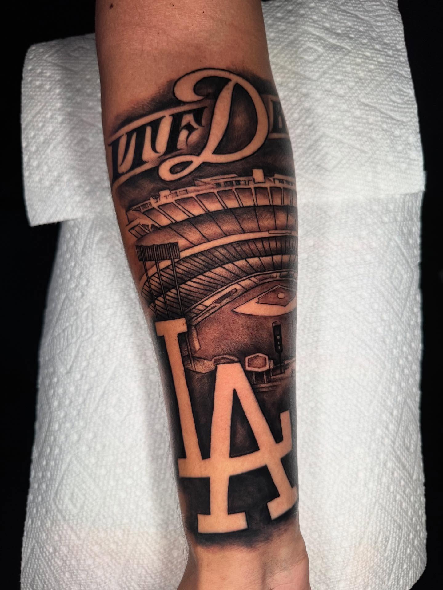 Dodger Stadium black and grey tattoo on the forearm by 𝕾𝖈𝖗𝖎𝖕𝖙 𝕾𝖕𝖊𝖈𝖎𝖆𝖑𝖎𝖘𝖙