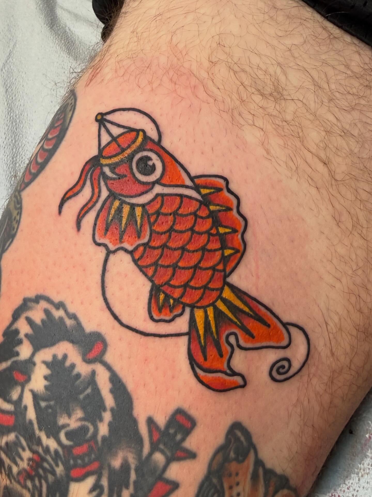 Koi fish American traditional tattoo on the forearm by Bill Crawford, Plymouth, Michigan