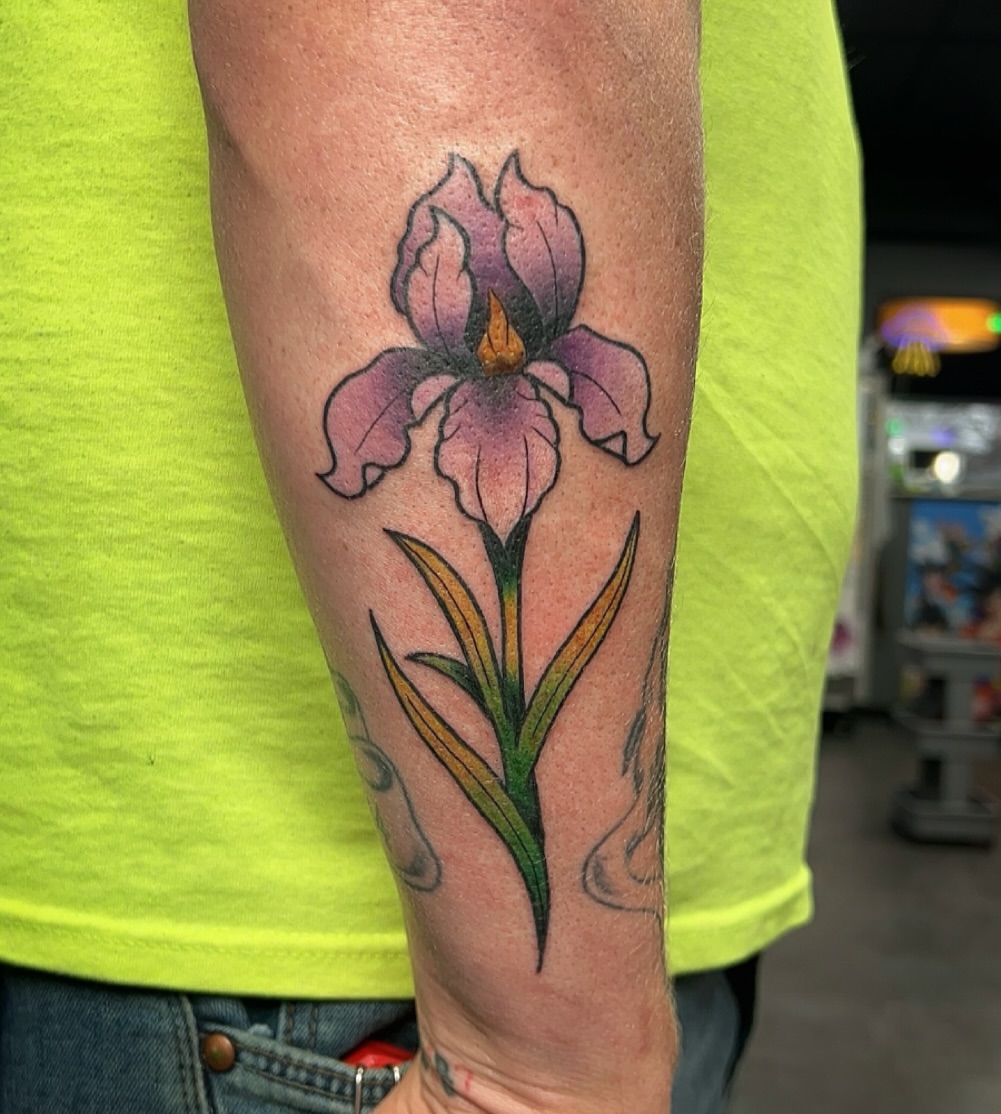Iris flower realism tattoo on the forearm by 𝑴𝒂𝒚𝒂𖤐𝑫𝒆𝑽𝒊𝒏𝒆, Dayton, Ohio