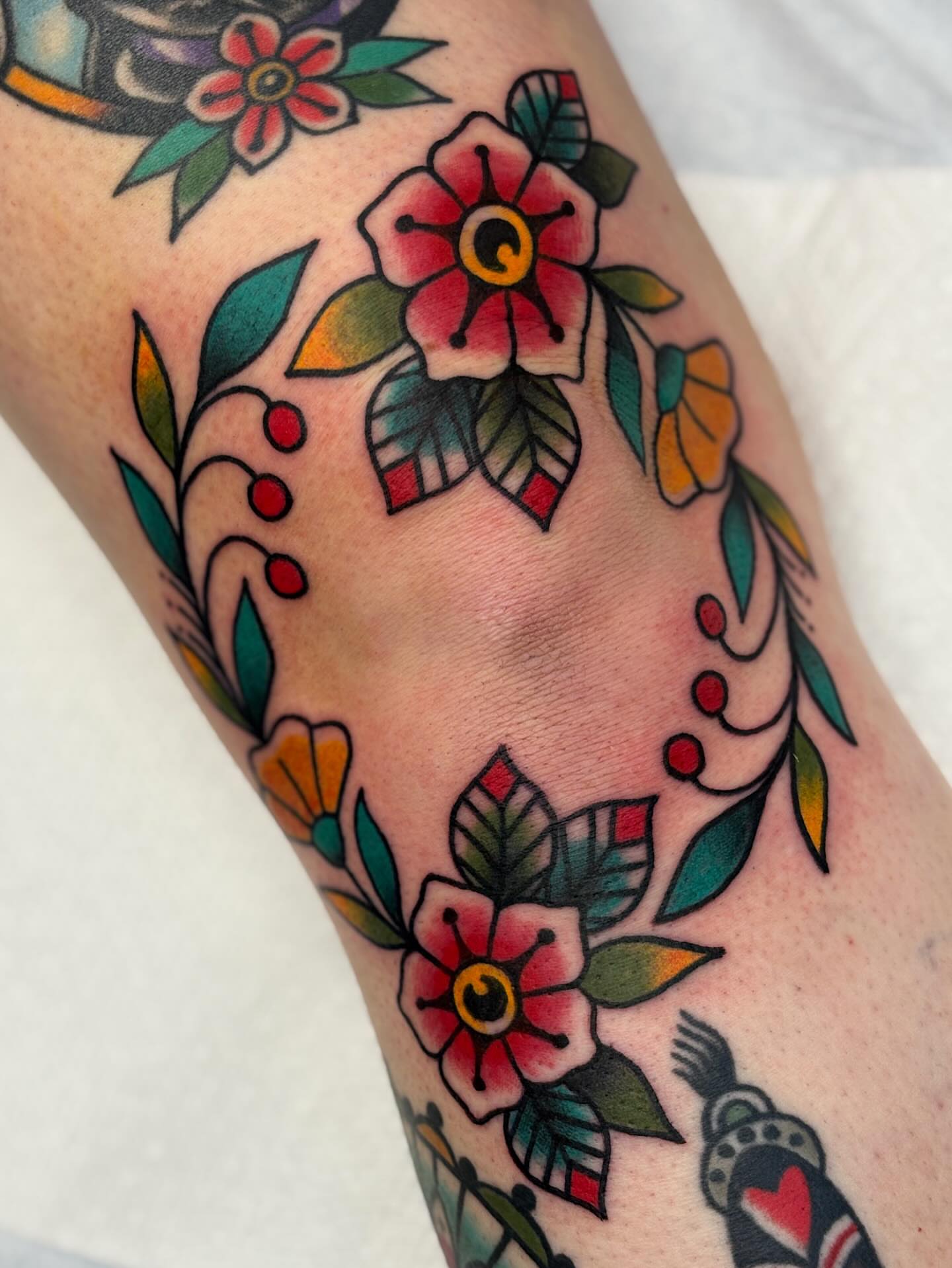 Floral arrangement American traditional tattoo on the forearm by Dakota Amato