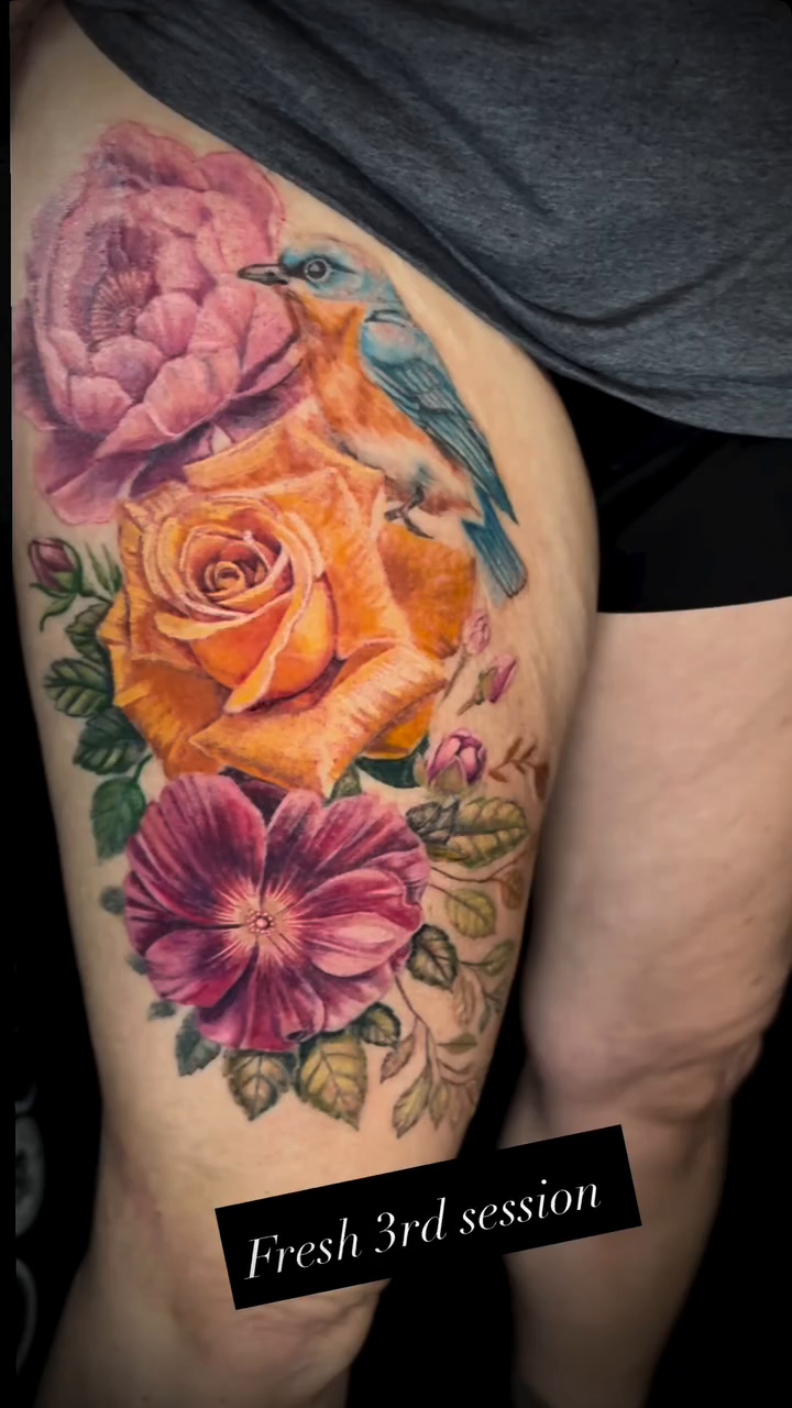 Floral arrangement with bird realism tattoo by Caitlin Curtis Tattoos & Booking, Dayton, Ohio