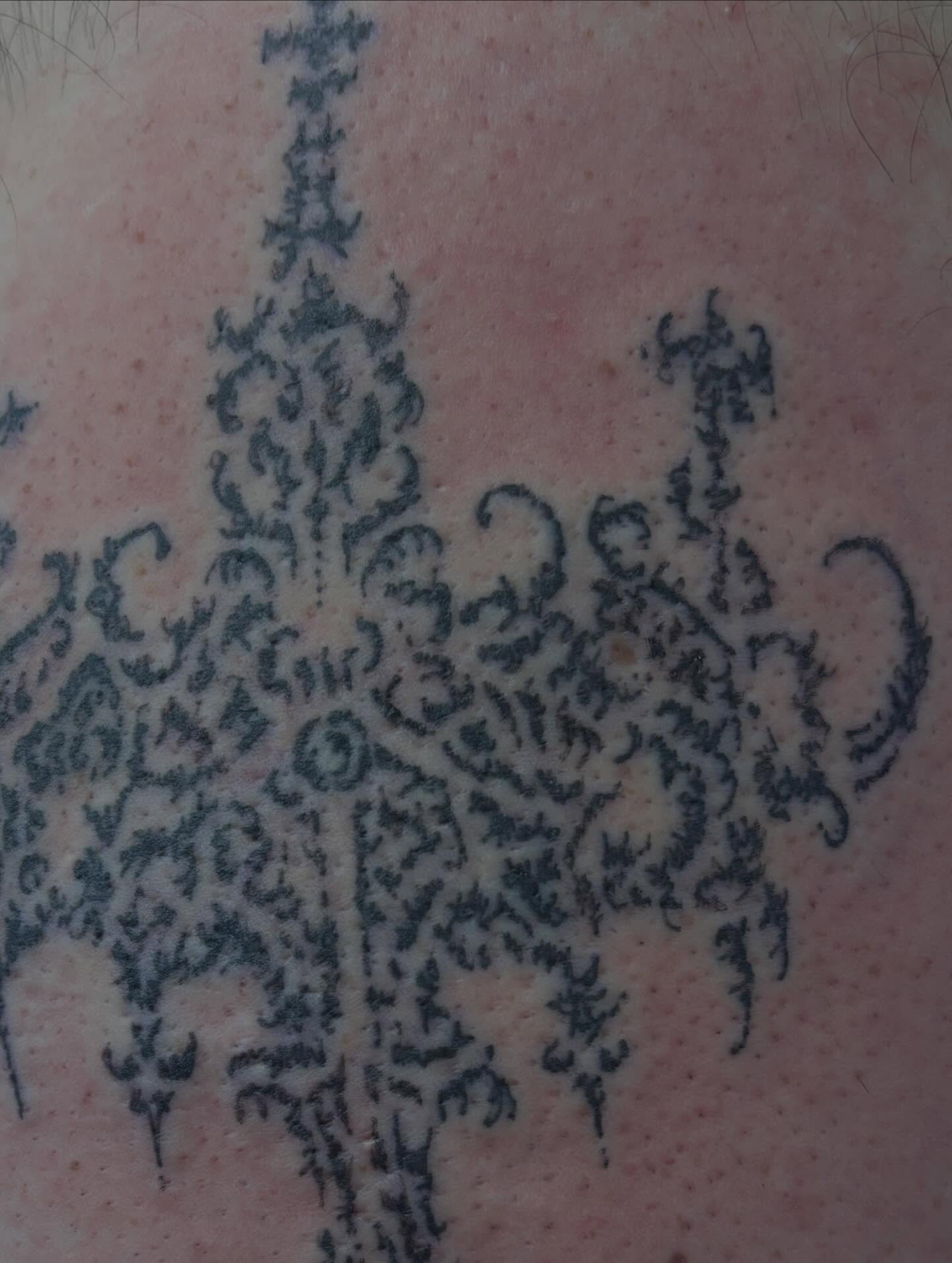 Floral pattern ornamental tattoo on the torso by Turner