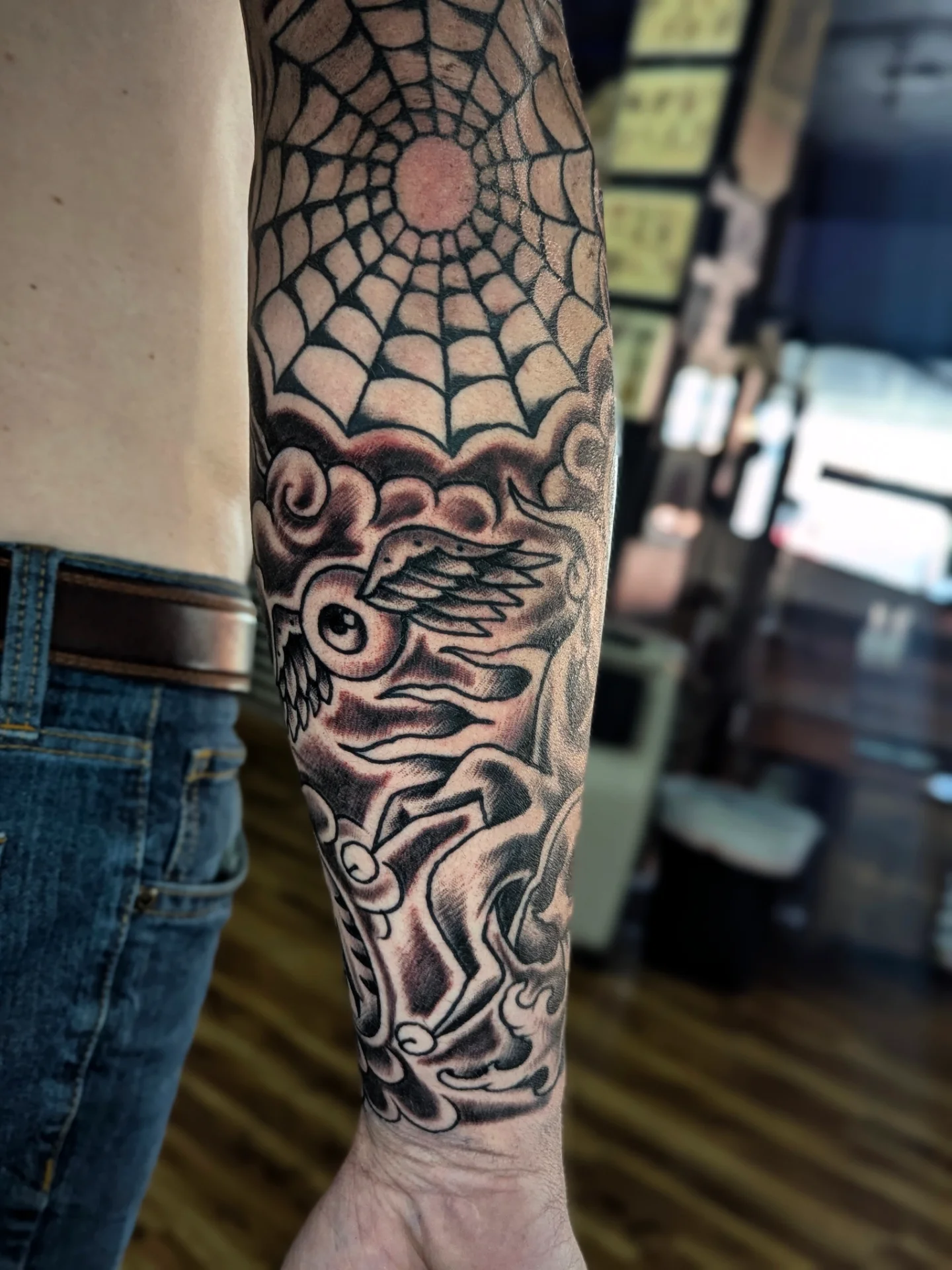 Dragon and sun japanese irezumi tattoo on the forearm by Eric Ward