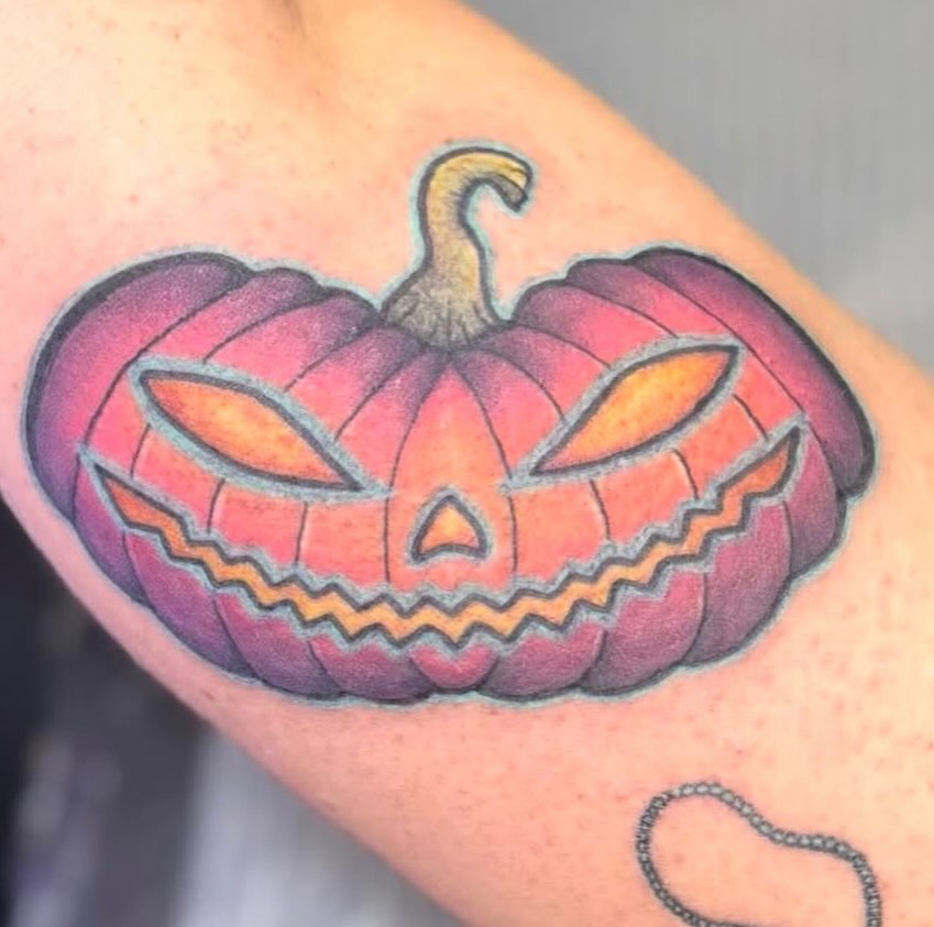 Jack-o'-lantern American traditional tattoo on the forearm by Olivia Buch