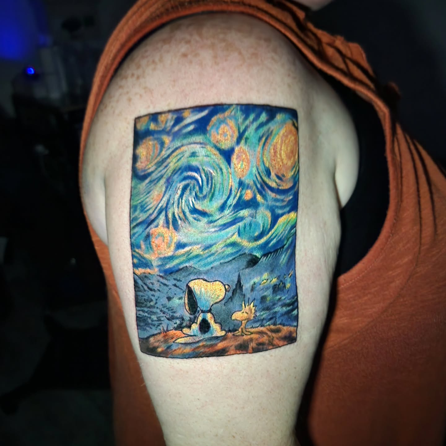 Starry night snoopy illustrative tattoo on the shoulder by Chris Bowen