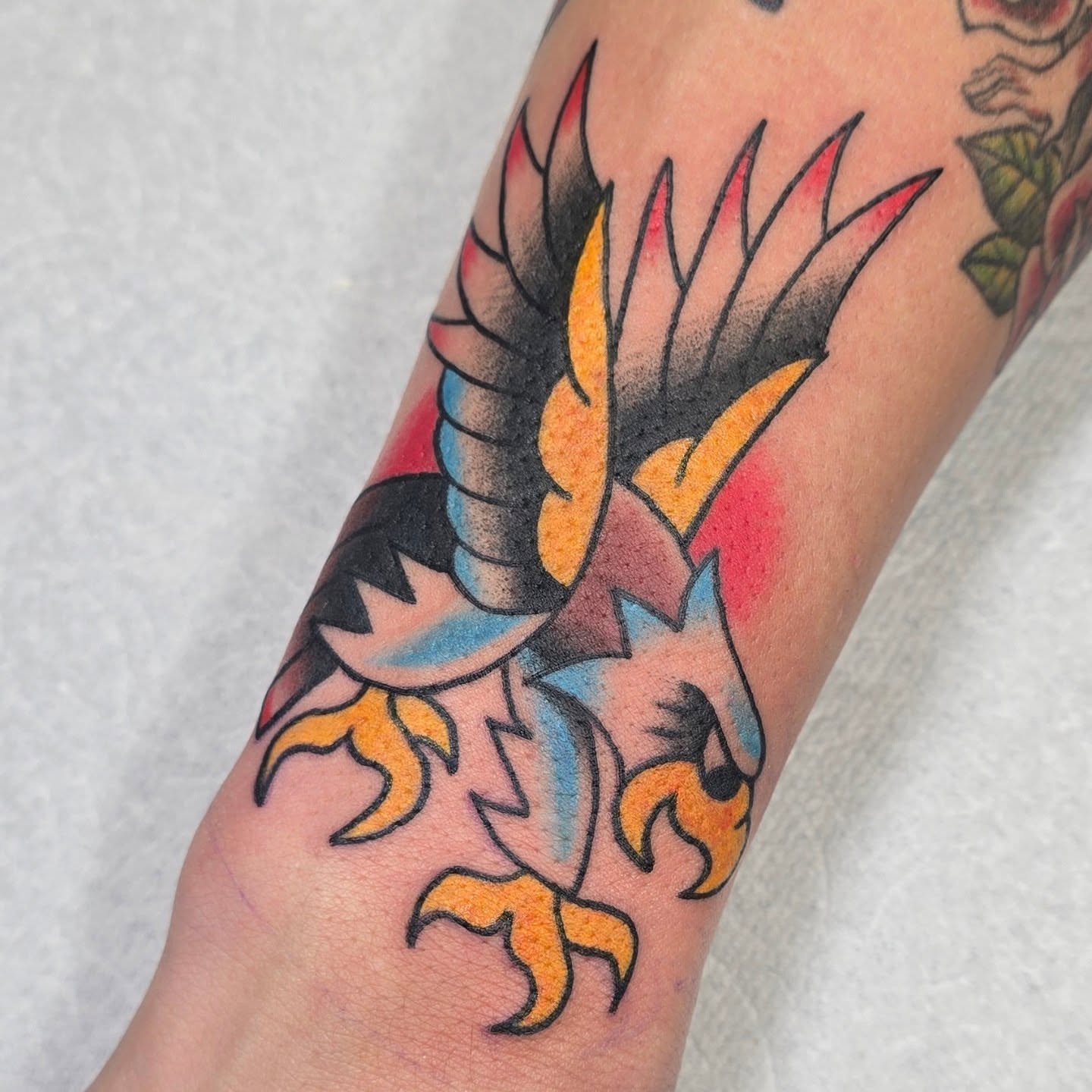 Phoenix American traditional tattoo on the forearm by A. Teixeira, Los Angeles, California