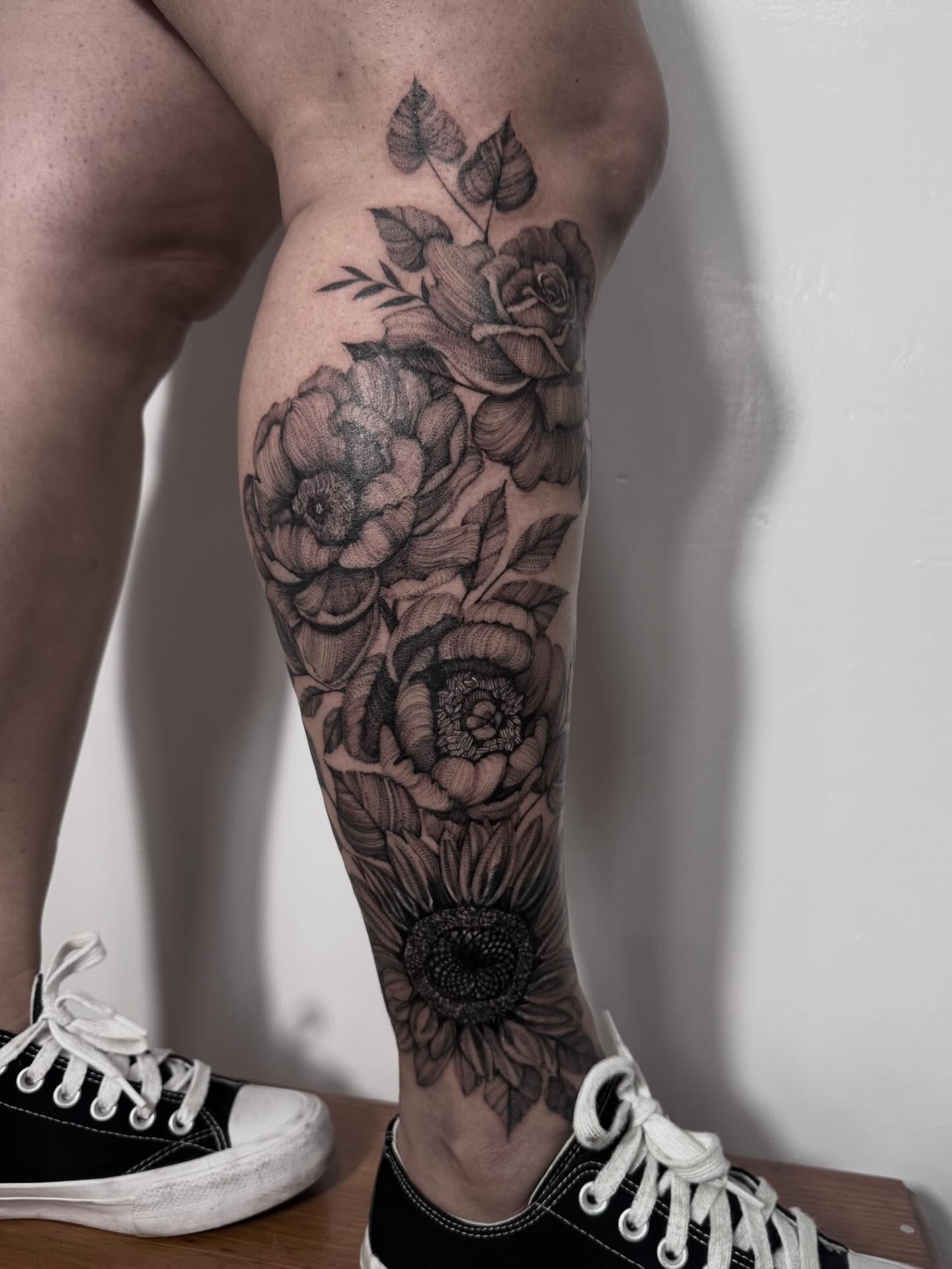 Floral bouquet realism tattoo on the calf by Tianna Osborne